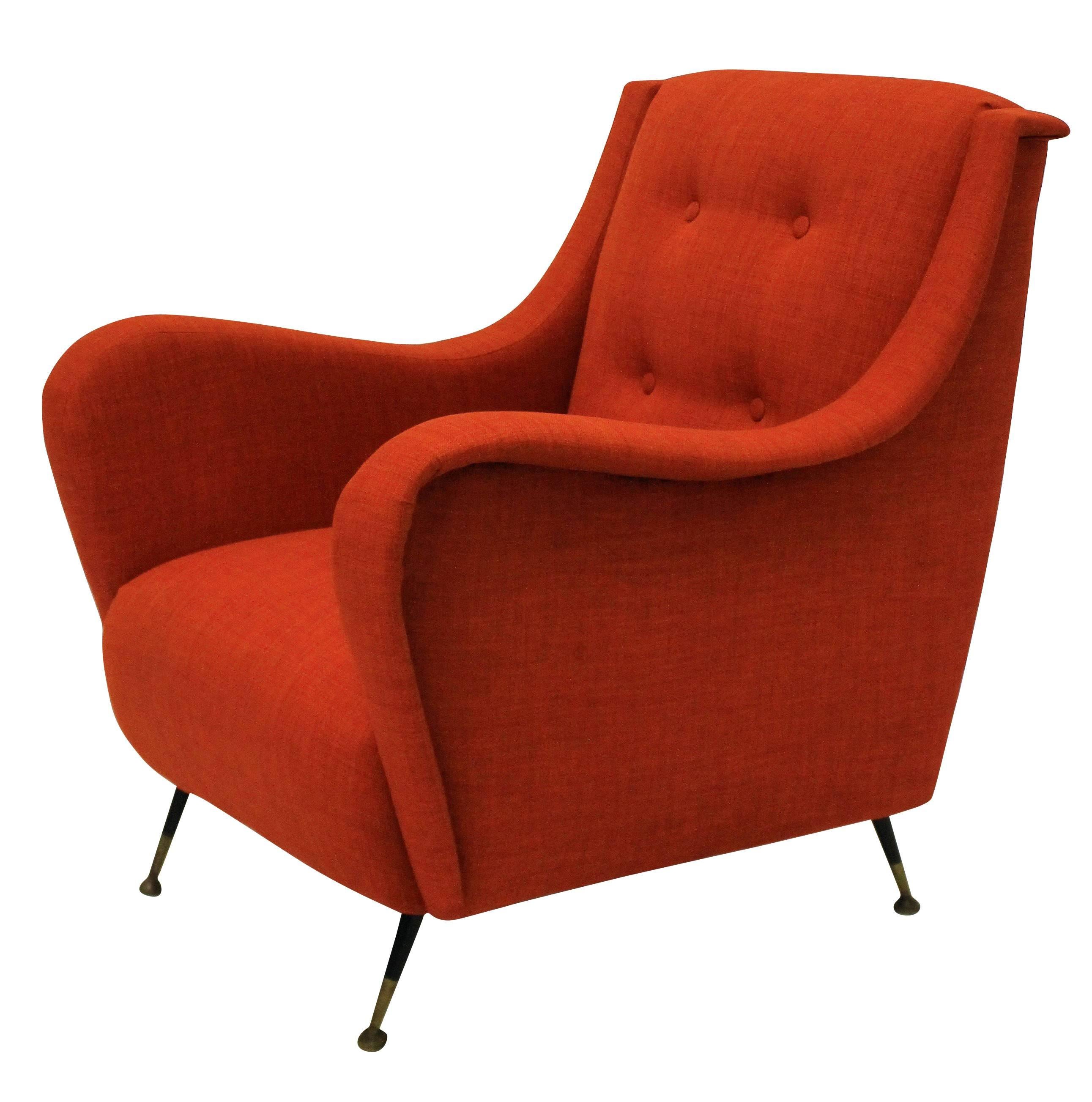 A pair of Italian midcentury armchairs on tapering metal feet. Newly upholstered in a burnt orange twill.