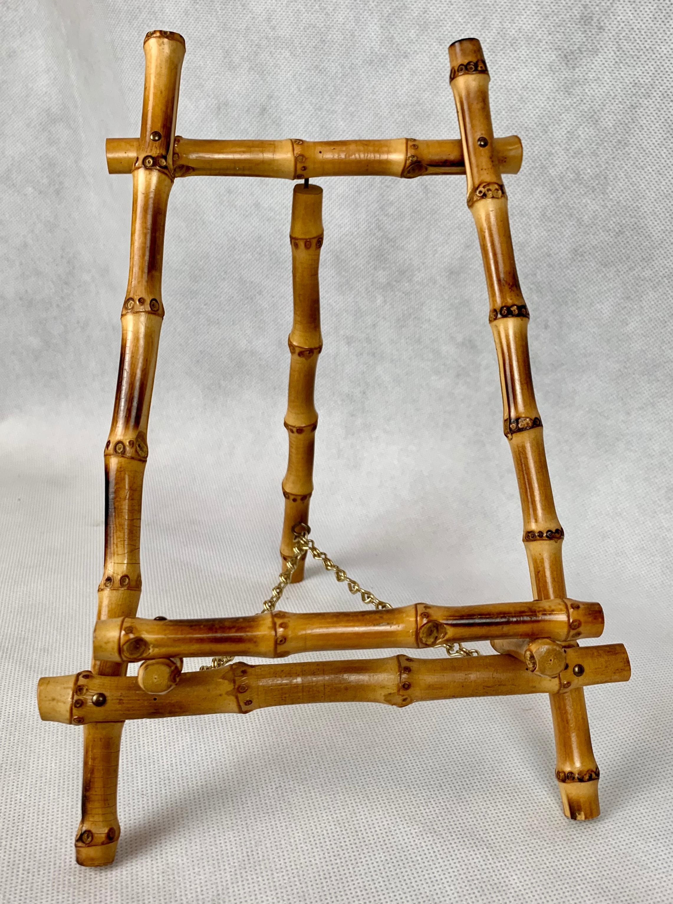 A pair of stylish bamboo easels complete with brass chains from the 1950s. They would be perfect to show off a pair of prints or other collectibles that would fit comfortably. You could try plates, flat plaques or photos. They are well made and in