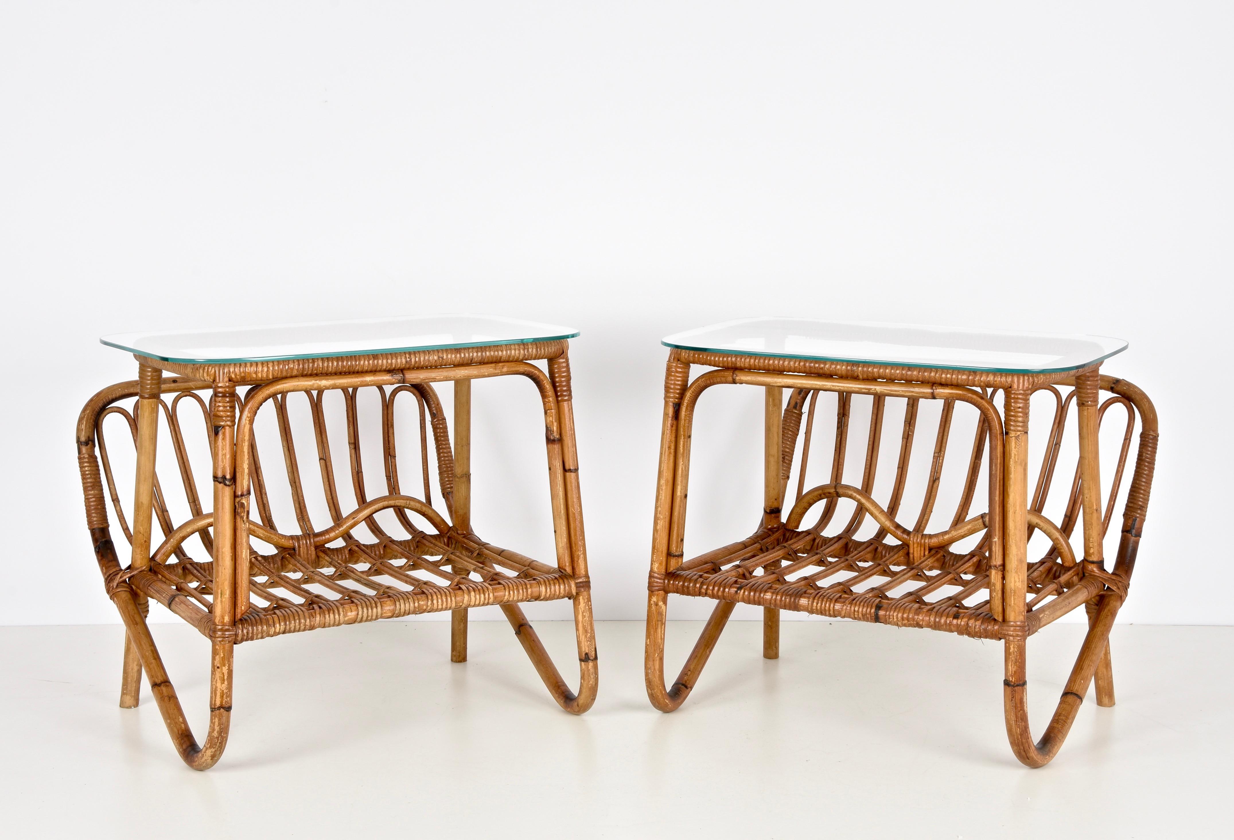 Amazing pair of midcentury bamboo magazine tack coffee tables with a glass shelf. This wonderful set was designed in Italy during the 1960s and was produced by Casa del Giunco Ciarralli in Rome.

You are going to love this fantastic set as the