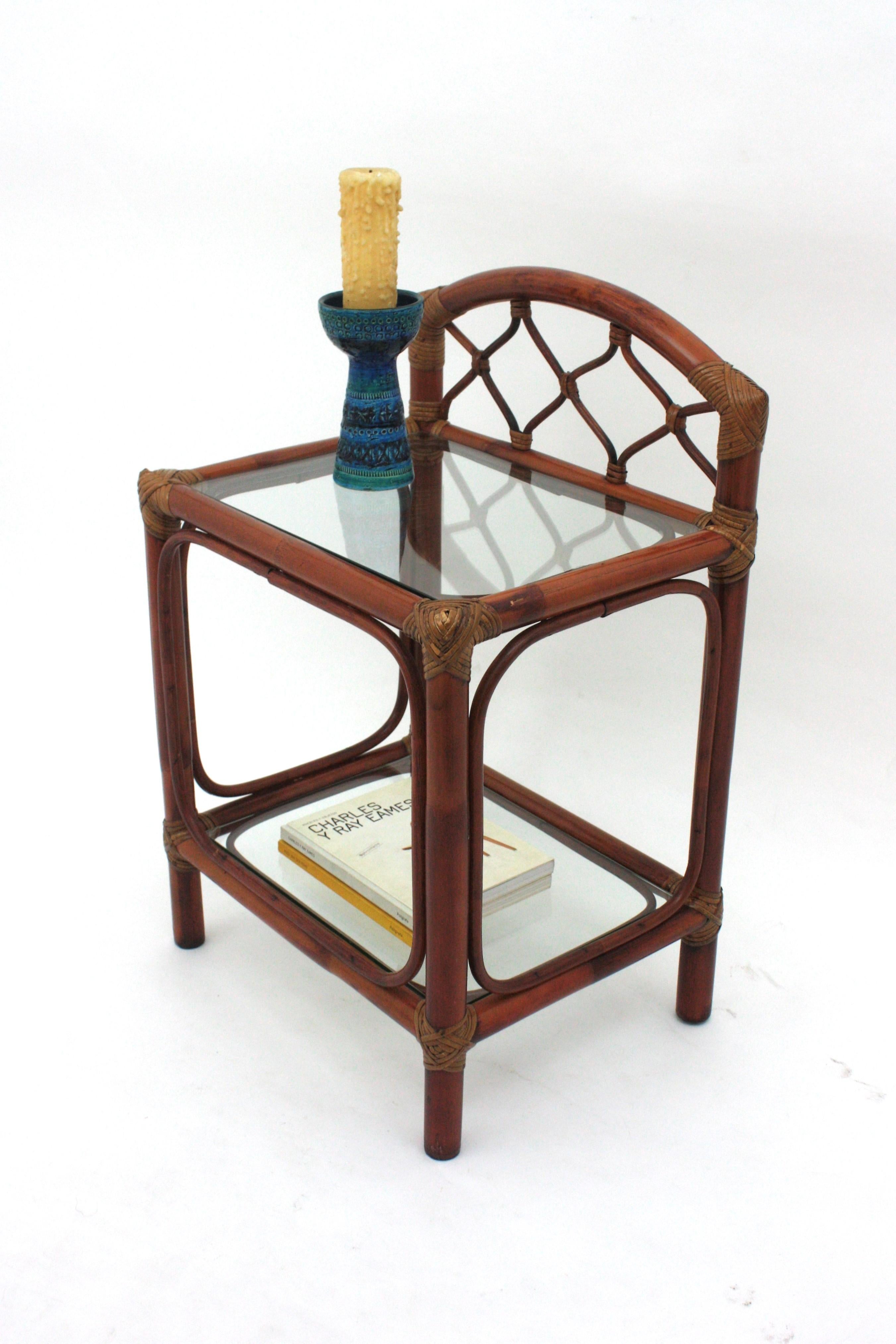 Pair of Spanish Two-level Bamboo Rattan Night Stands with Arched Design and Glass Tops, Spain, 1960s
__________________________________________________________
Beautiful pair of rattan arch nightstands, end tables or bedside tables with a arch top.