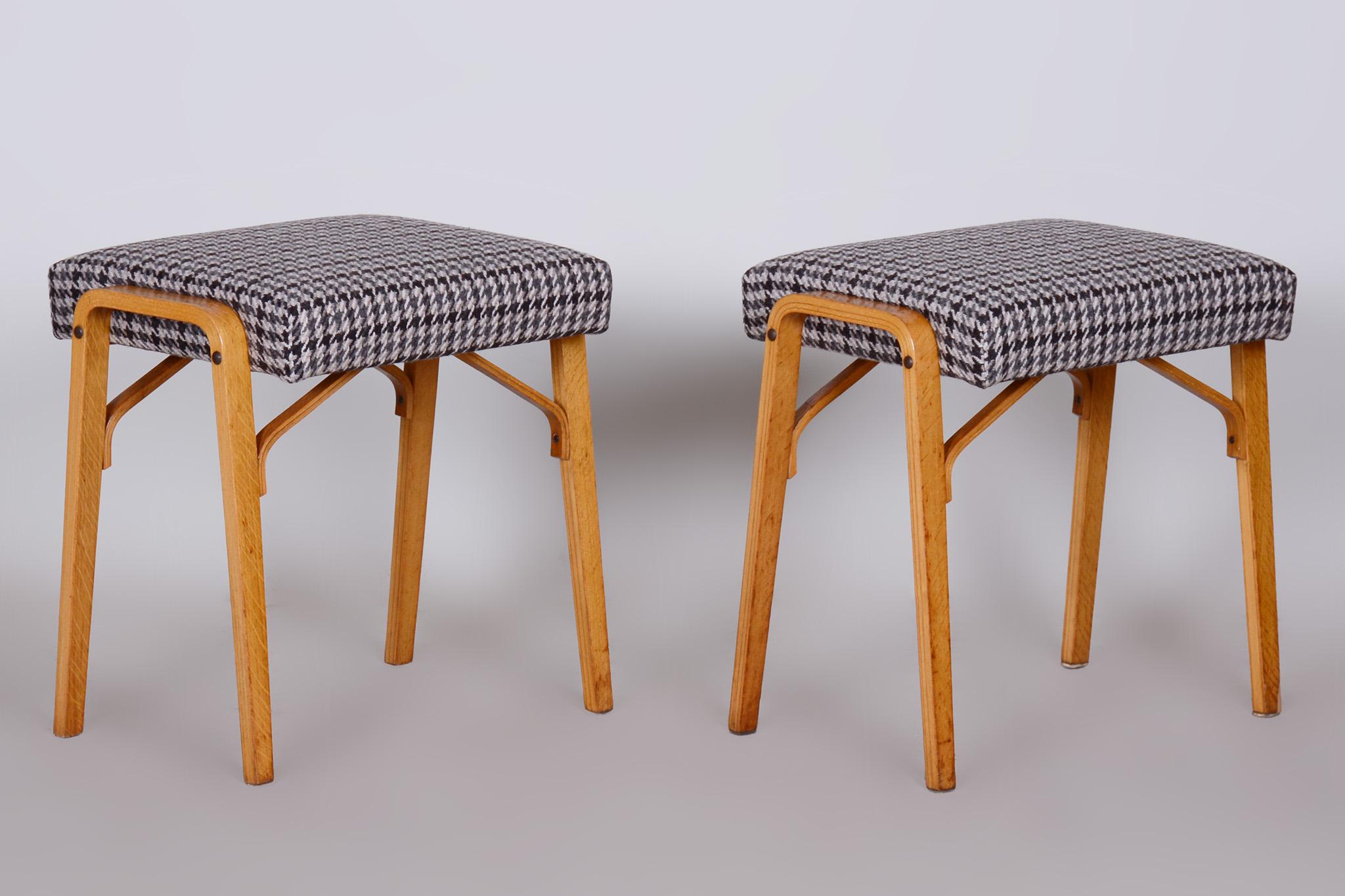Pair of Midcentury beech stools

Architect: Ludvik Volak
Maker: Drevopodnik Holesov
Source: Czechia (Czechoslovakia)
Period: 1950-1959
Material: Beech, Fabric, Upholstery, Plywood

Stable construction made of shaped plywood.
Refreshed