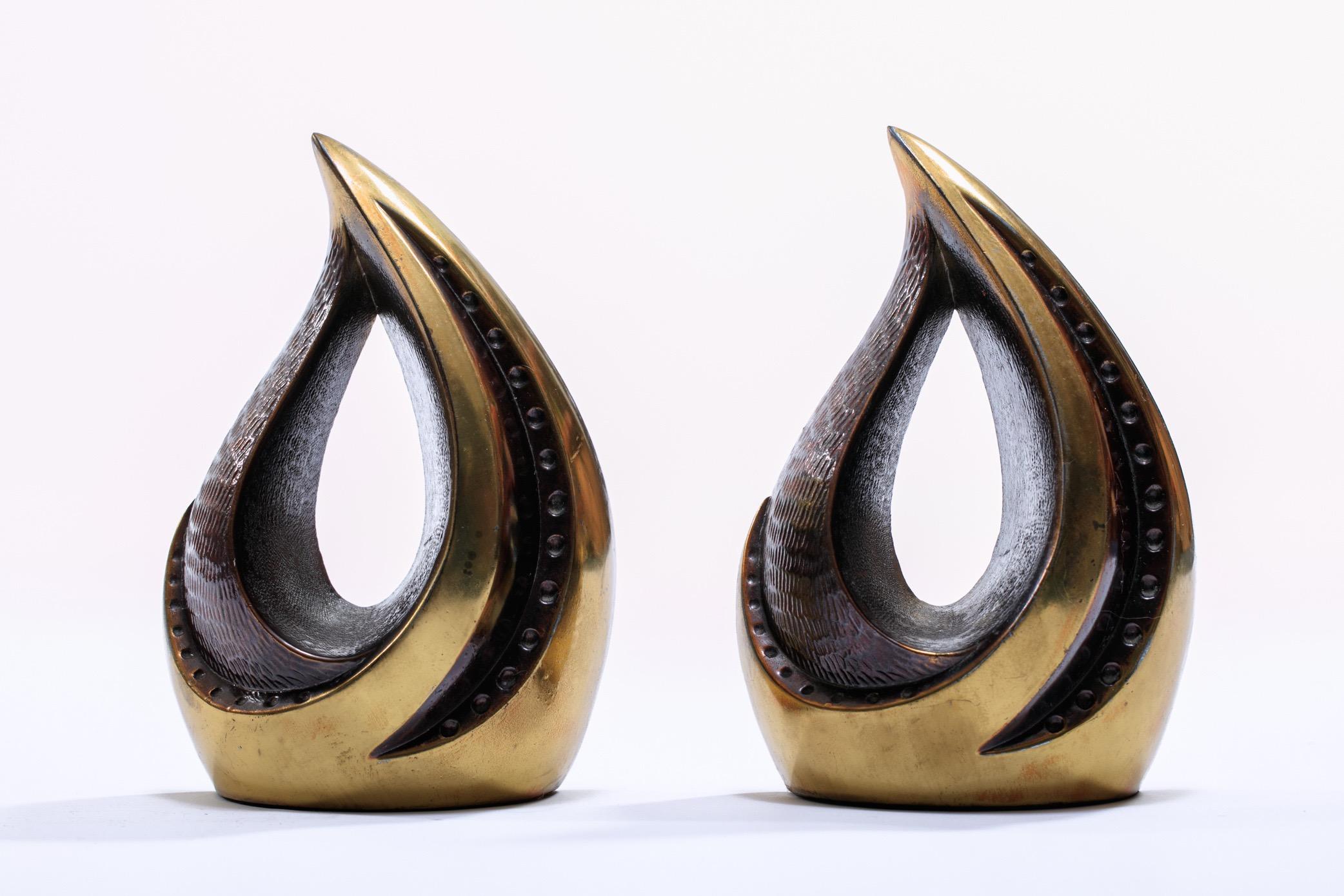 Sculptural brass Ben Seibel for Jenfred bookends, circa 1950s. A freeform, organic design in brass finish with applied patina that has deepened over time giving them an even more rich character. Want to see more beautiful things? Scroll down below