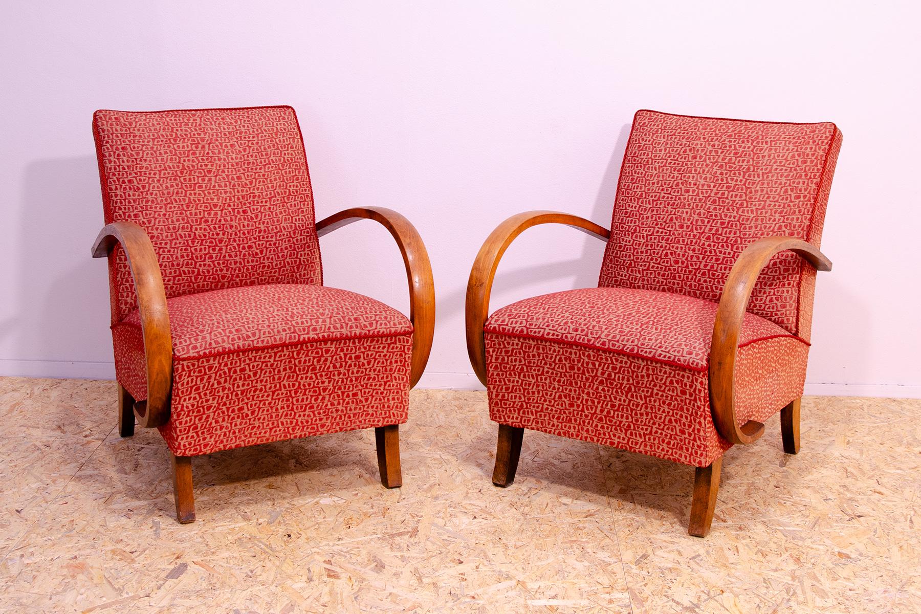 Pair of midcentury bentwood “C” armchairs designed by Jindřich Halabala and produced by UP Závody in the 1950´s. The chairs are stable and comfortable and overall are in good preserved Vintage condition, the fabric shows signs of age and