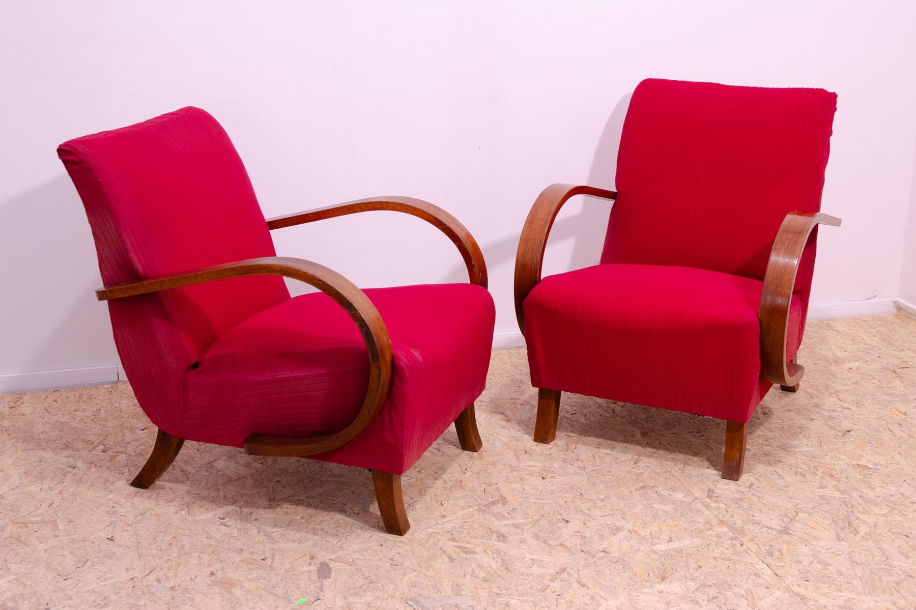 Pair of midcentury bentwood “C” armchairs designed by Jindřich Halabala and produced by UP Závody in the 1950´s. The chairs are stable and comfortable and overall are in good preserved Vintage condition, the fabric shows signs of age and
