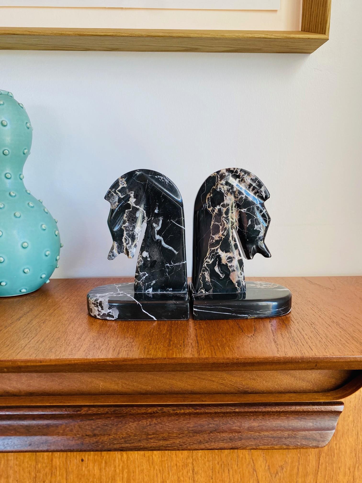 Very stylish pair of midcentury marble horse head bookends, circa 1970s. The bookends are heavy and well crafted, Dark marble with organically elegant veining add classic style with edge. Great addition to any office or den. Each is 6