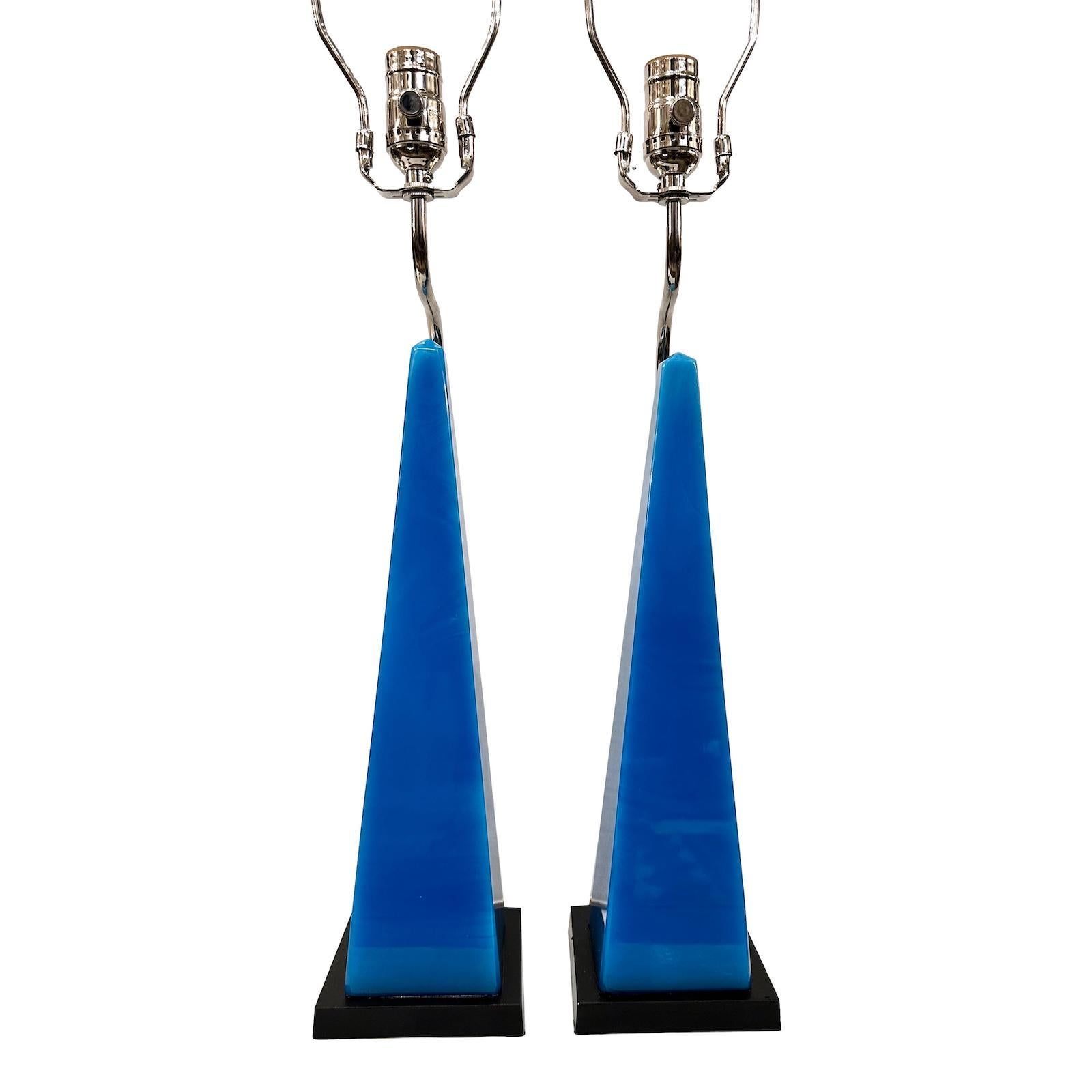 Pair of circa 1950’s French blue glass obelisks mounted as lamps.

Measurements:
Height of body: 18″
Height to shade rest: 30″
Base: 5″ x 5″