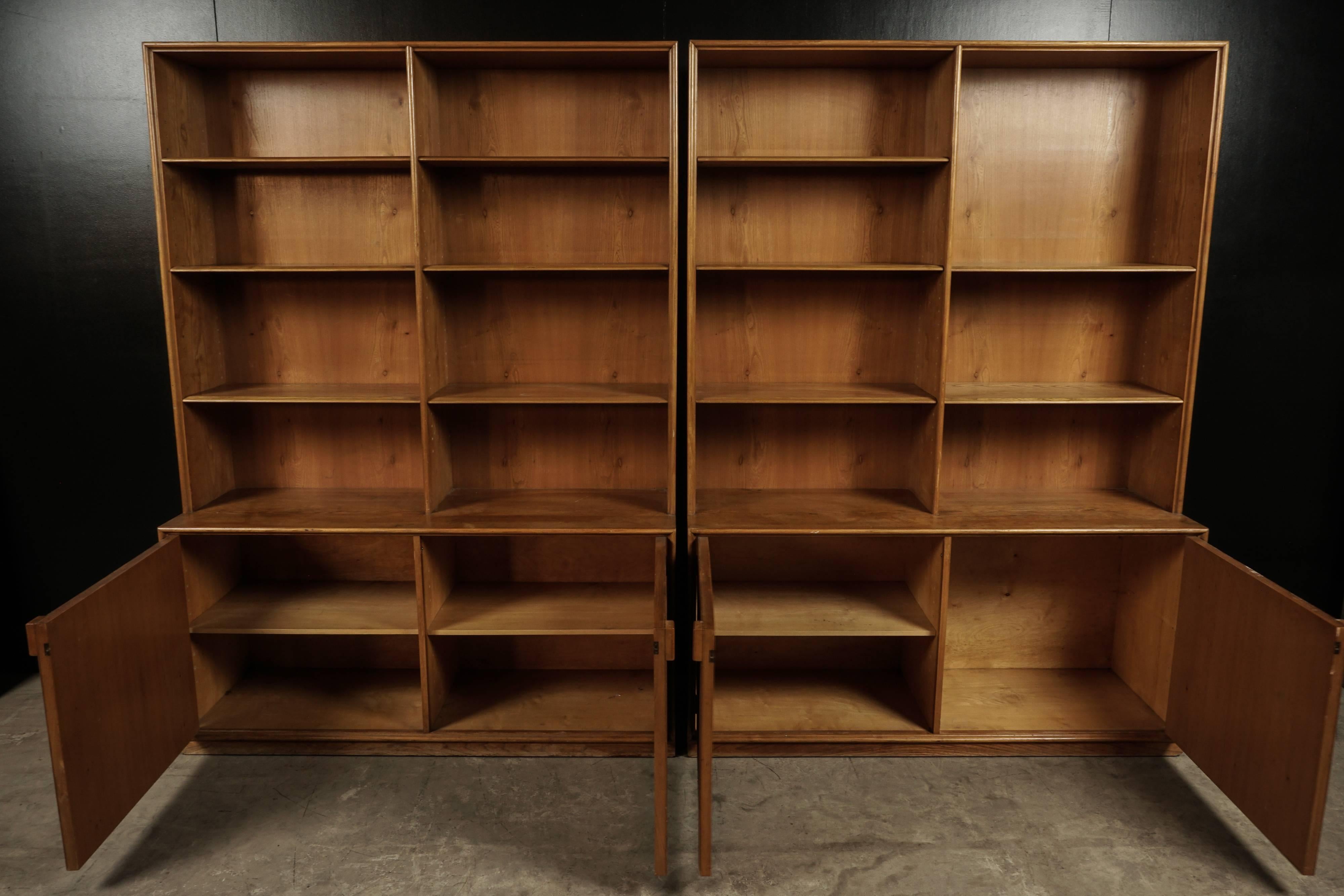 Pair of midcentury bookcases from Denmark, circa 1960. Designed by Frode Holm, and manufactured for Illums Bolighus, Denmark. Two units made of elm wood, with adjustable shelves.