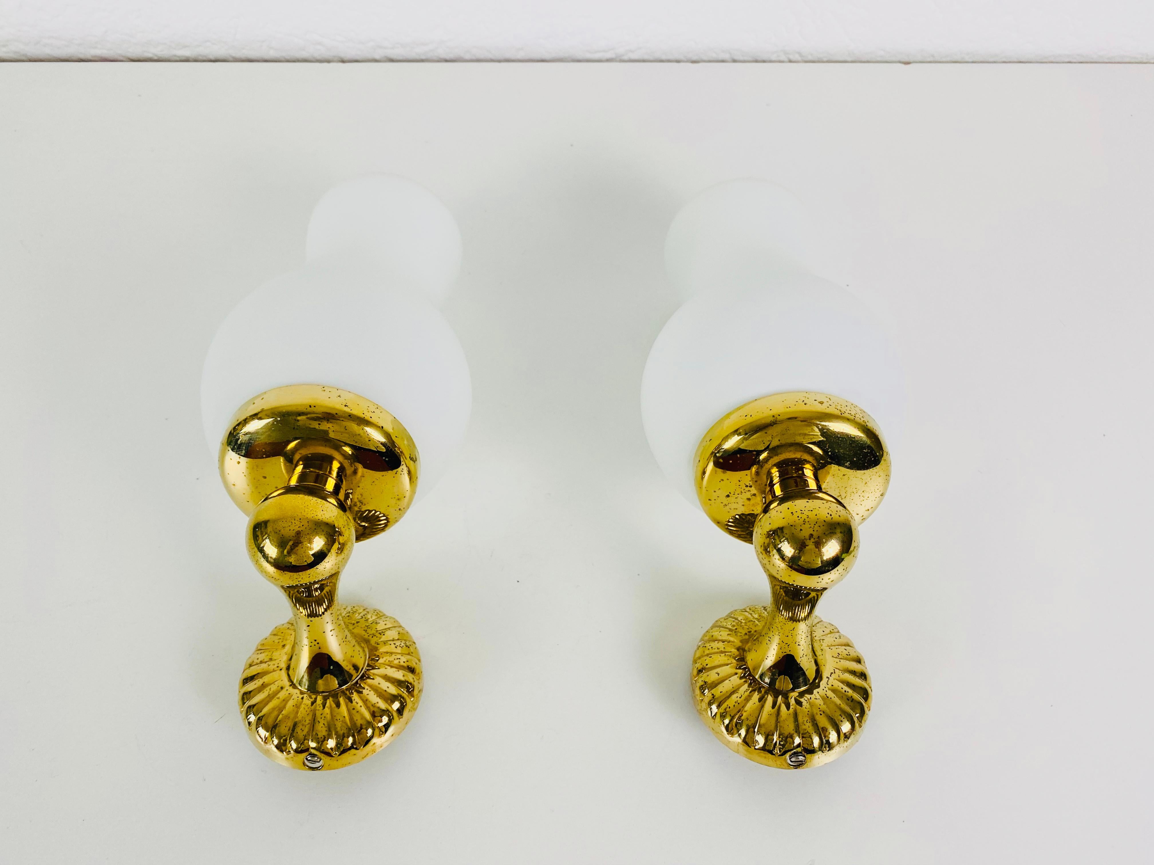 Mid-20th Century Pair of Midcentury Brass and Opaline Glass Wall Lamps, Italy, 1960s For Sale