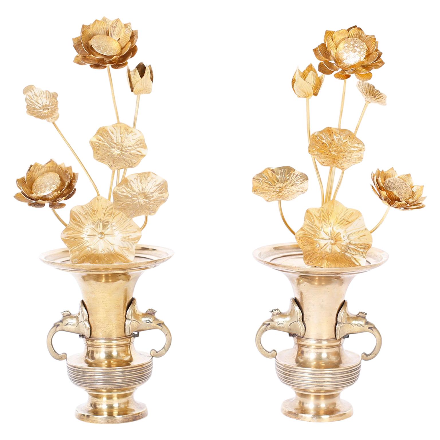 Chic pair of Asian modern lotus flower arrangements blooming in assorted stages in Classic form, brass vases with elephant head handles. Hand polished for easy care.