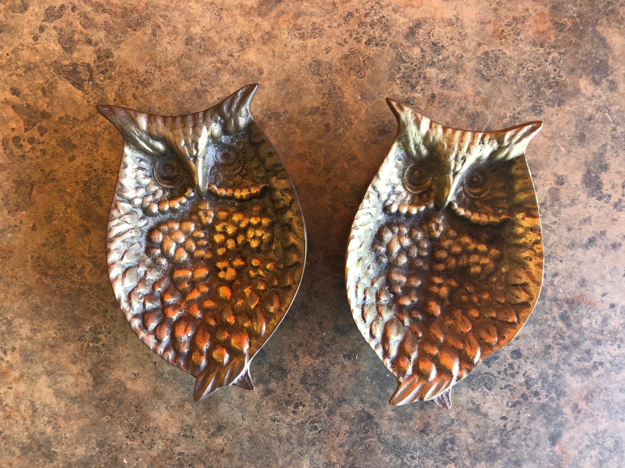 A fun pair of small brass trinket dishes cast in brass in the shape of an owl, circa 1960s.