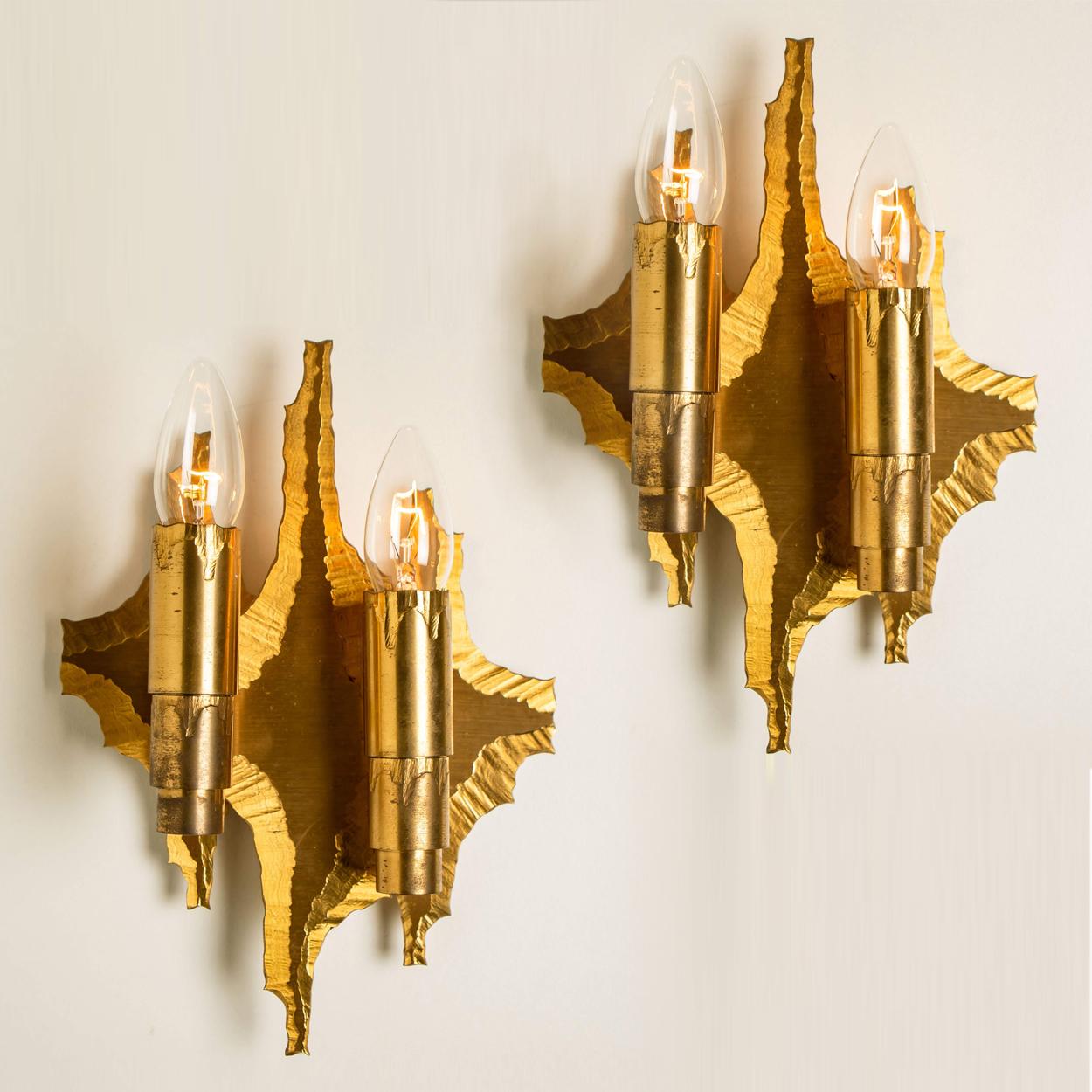 A pair of Brutalist wall sconces from the 1970s, Sweden. An absolute strong and sculptural design! One of a kind design. 

Cleaned and well-wired, in full working order and ready to use. The fixtures are in excellent condition. Each with 2 E14