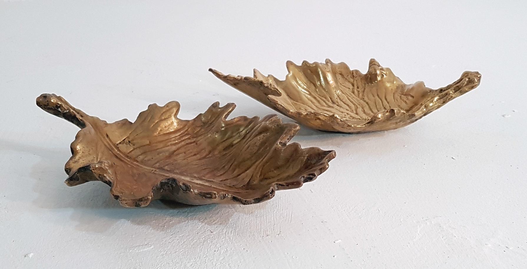 A pair of identical cast bronze tray for keys, nick-nacks or as ashtray, or simply because it’s beautiful. Note the little lady bug on the edge of the leaf. With a slight difference in tone they play off each other like natural leaves almost.