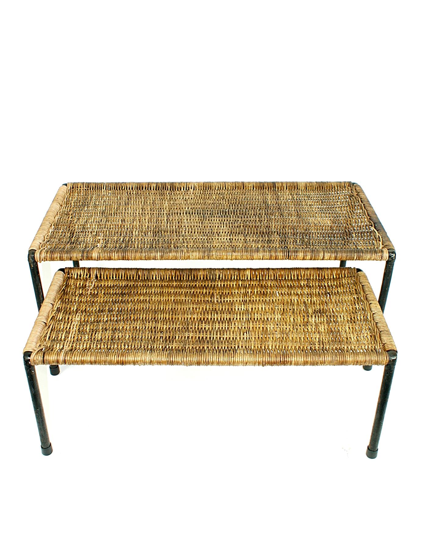 Beautiful and authentic rattan top coffee or side tables, manufactured by Carl Auböck Werkstätte in the 1950s, Vienna. The frames are made of black lacquered steel with woven rattan top. The tables can be used indoor and