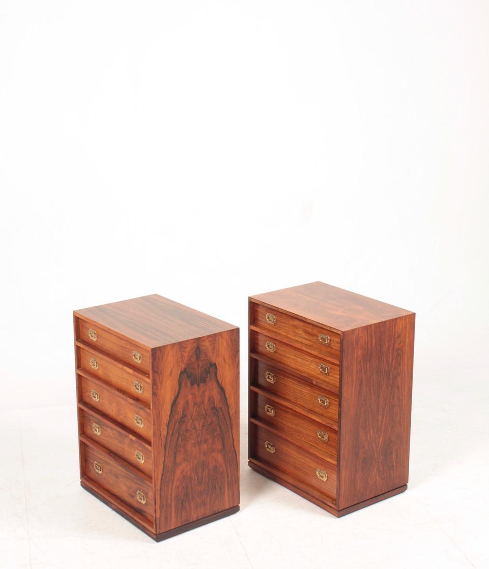 Pair of chest of drawers in rosewood. Works well as nightstands or side tables. Designed by Henning Koch, in the 1960s. Great condition.