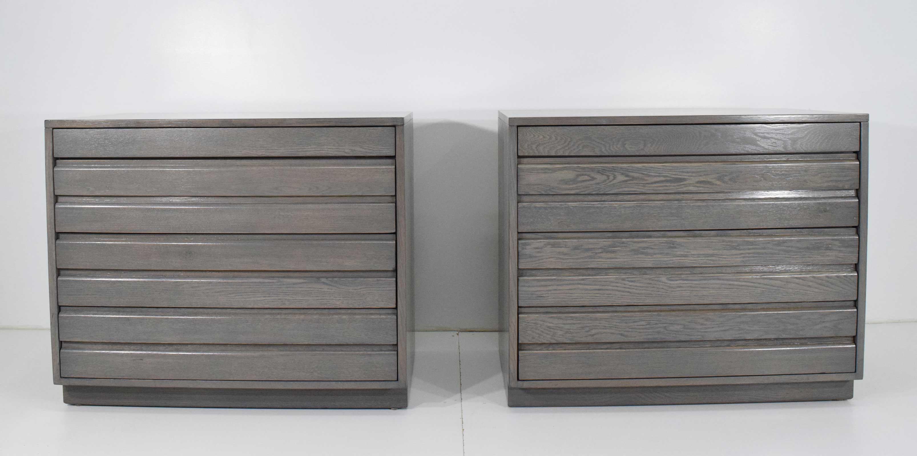 These Sligh chests have been restored and stained in a grey which shows the beautiful graining of the wood. Chests have four drawers each. Great for nightstands or where ever you need two matching chests.