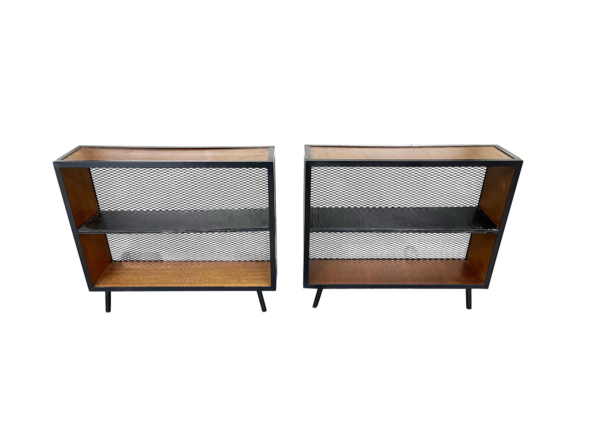 Made in the 1950s, this pair of bookcases is designed with balance and airiness in mind. They are comprised of angle iron frame, plywood with birch veneer, and black, cerused wooden shelves. They have been newly refinished.

Dimensions:
36 in.