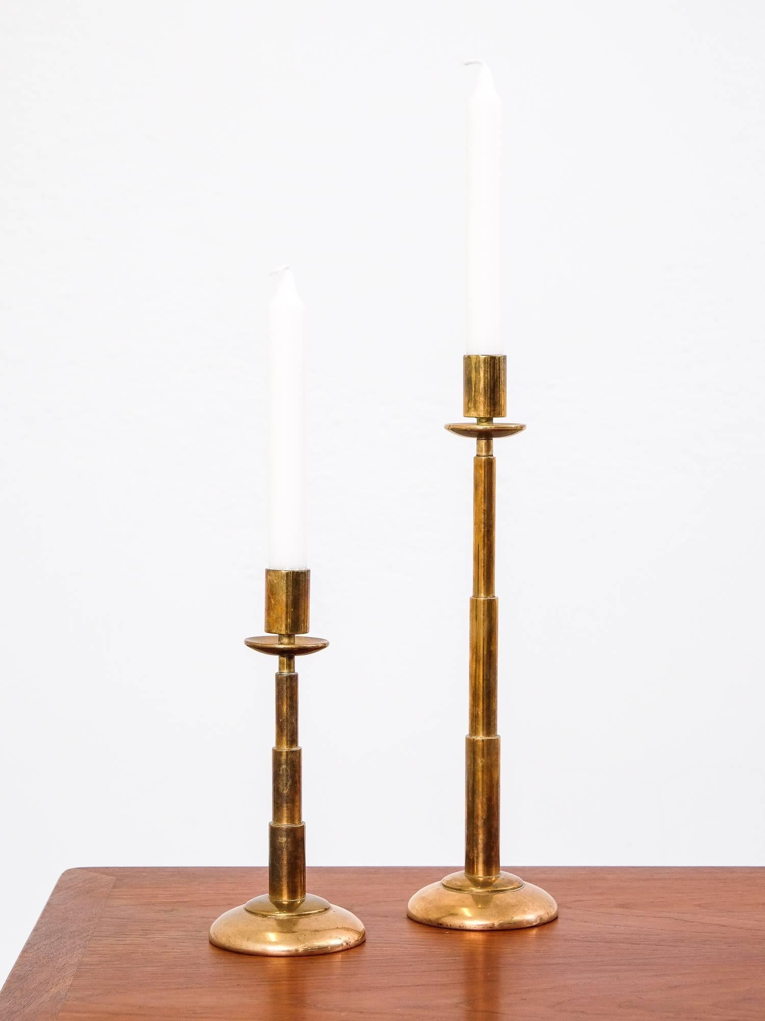 Nice, heavy brass candlesticks from Denmark. No markings.

Taller ones height is 33.5 cm
Shorter one 21.5 cm.