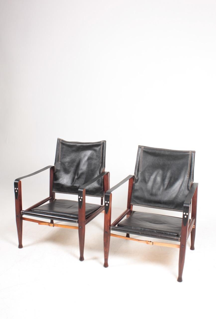 Pair of safari chairs in leather. Designed by Maa. Kaare Klint for Rud Rasmussen cabinetmakers of Denmark in 1933. Great original condition.