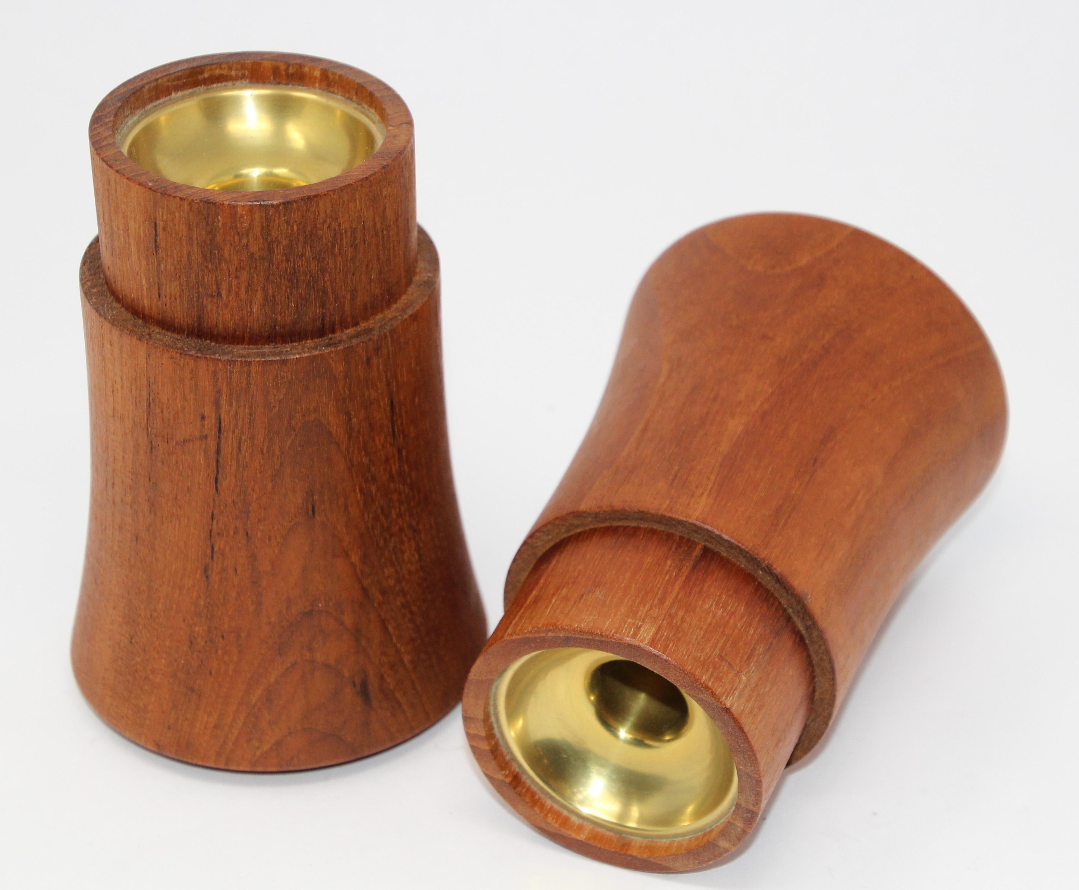 Midcentury Danish modern teak and brass candleholders by Dansk.
Midcentury handcrafted teak candlestick holders.
These elegant 5.25