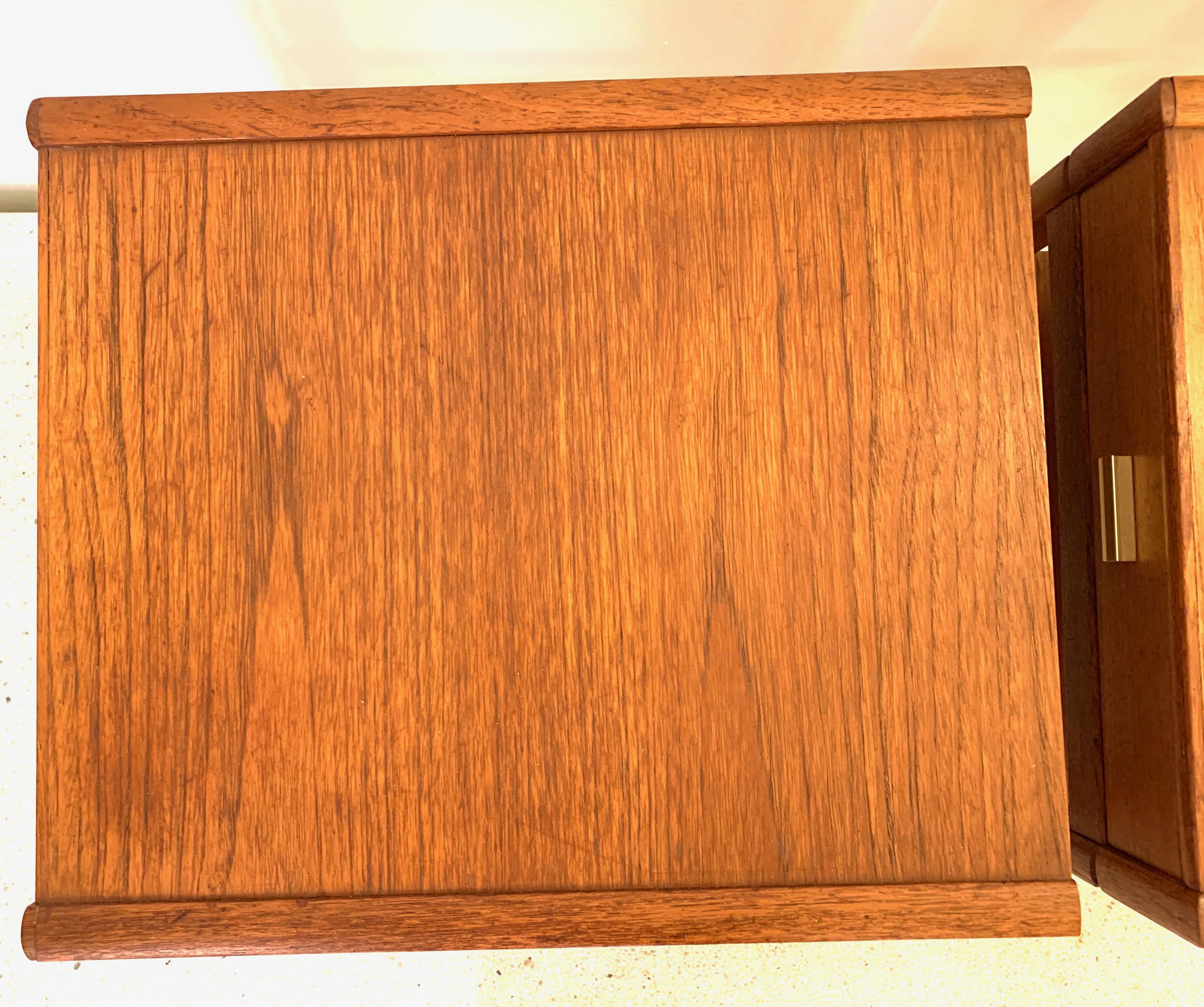 Pair of Danish midcentury nightstands, produced, circa 1960s. Featuring a Teak frame with a drawer and a shelf, beautiful handles made of brass. Very good condition with only a few marks and fading’s.
Minimalistic Classic Scandinavian design.