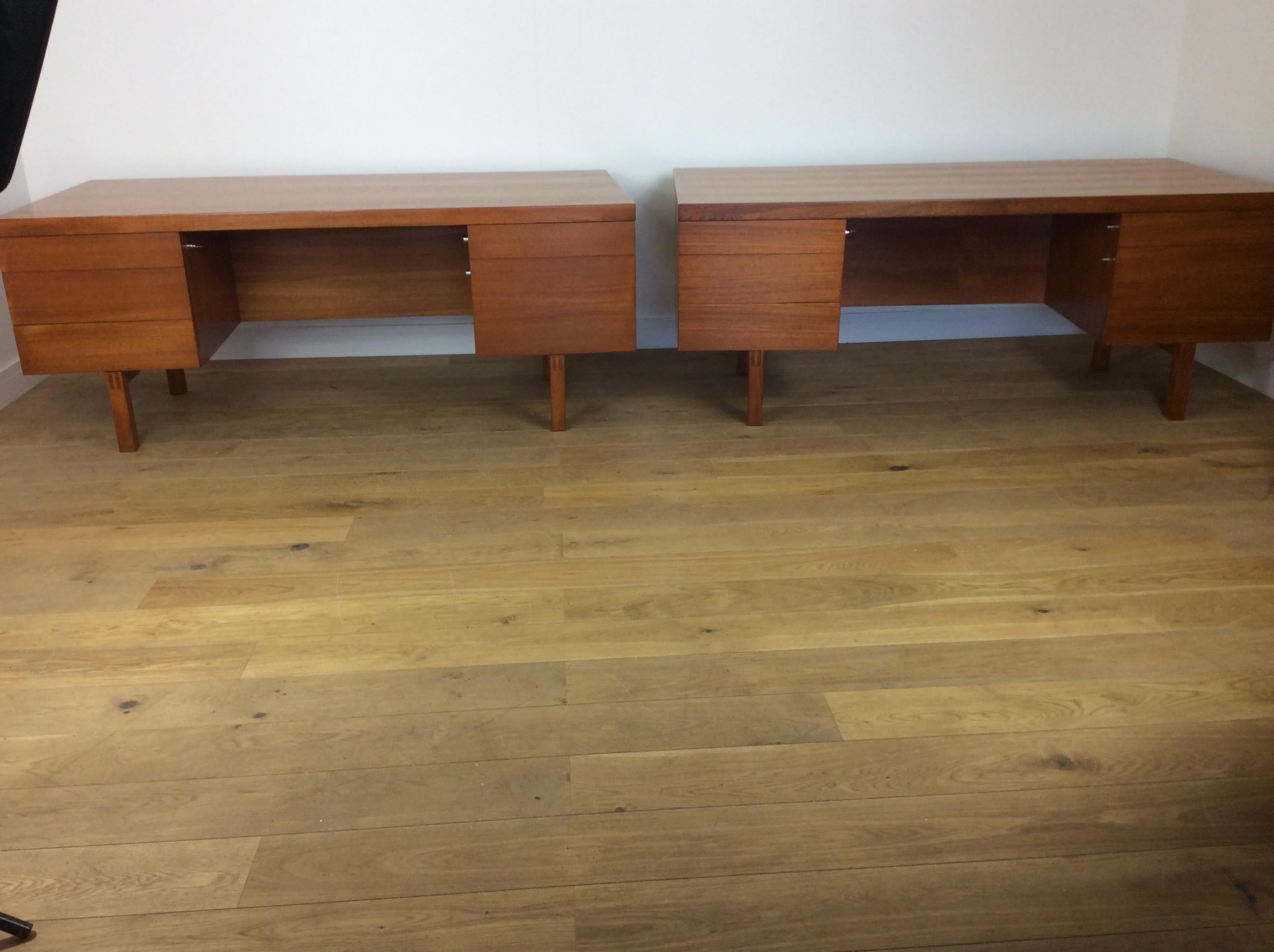 A pair of midcentury desks by Alfred Cox.
These rare examples have come from the storage rooms of the British Museum.
Beautiful streamline desks in a Fine teak wood.
No handles or drawer pulls giving these a sleek clean appearance.
A pair of
