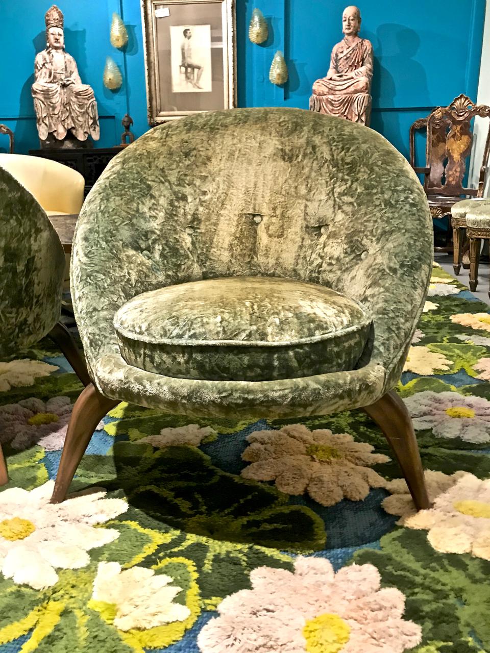This is a superb pair of all original midcentury Egg-form club chairs in the style of Jean Royere. The chairs retain their original lime green crushed velvet upholstery; the legs are a sexy spider leg classic mid-century design.