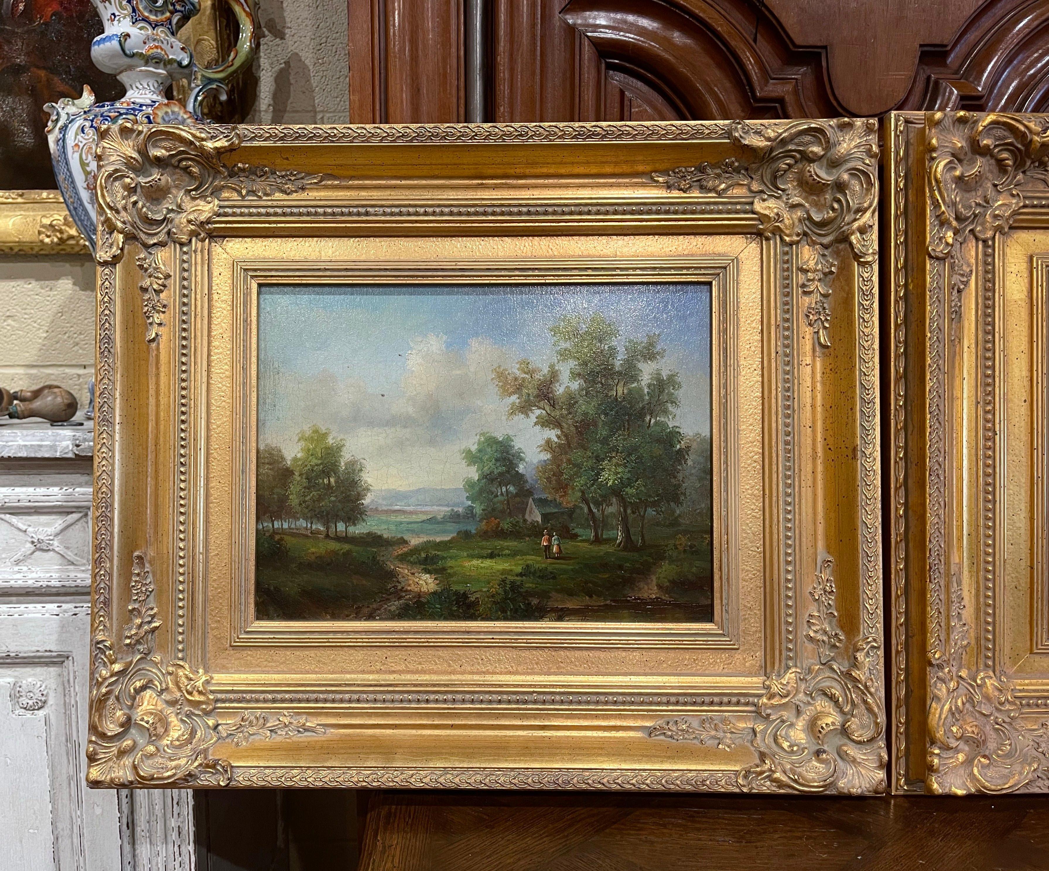 Decorate a living room or office with this elegant pair of antique paintings. Created in England circa 1950, both colorful art work are set in a carved gilt wood frame. Each composition depicts a traditional pastoral scene; one with a couple