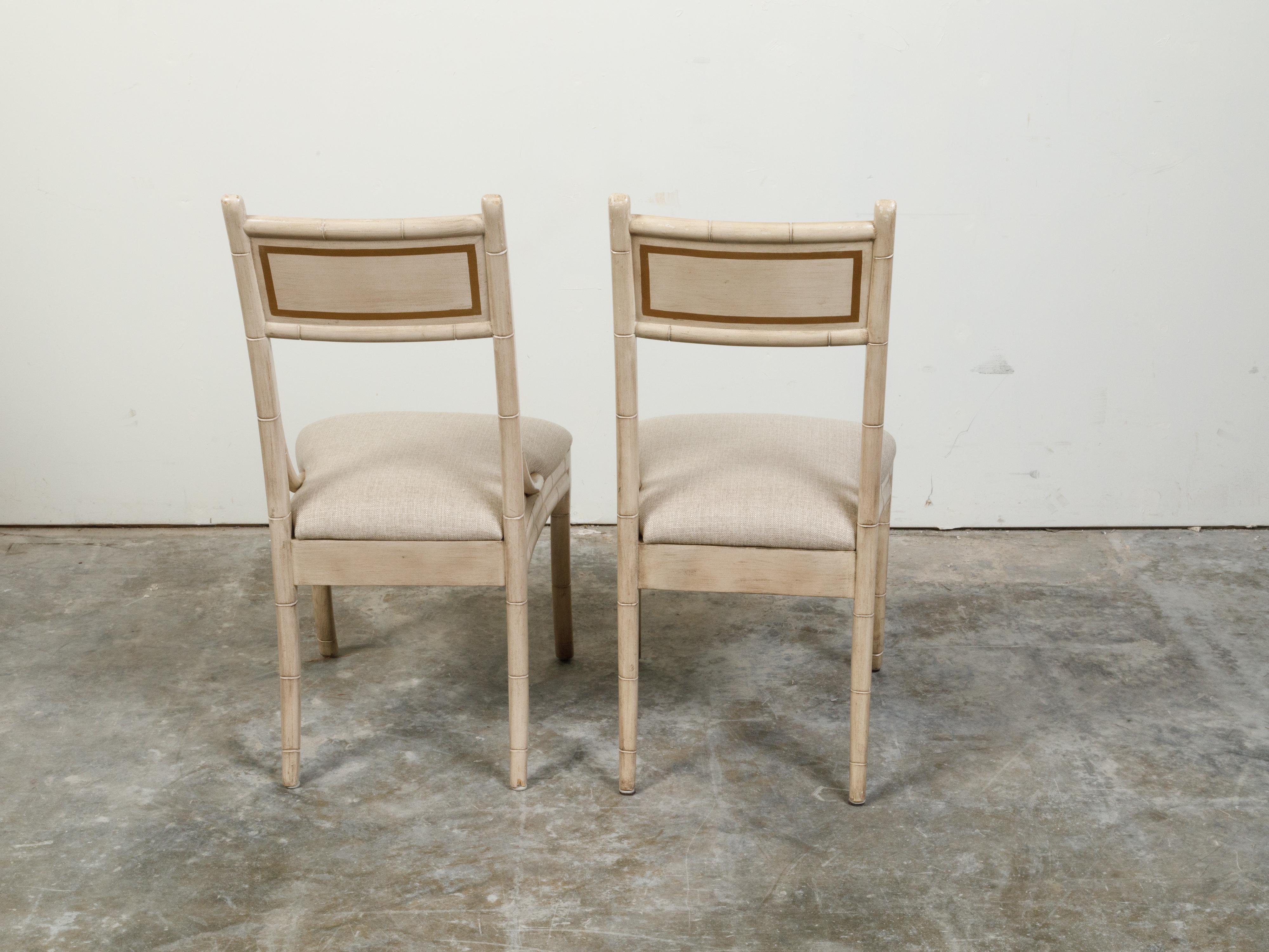 20th Century Pair of Midcentury Faux Bamboo Side Chairs with Saber Legs and New Upholstery For Sale