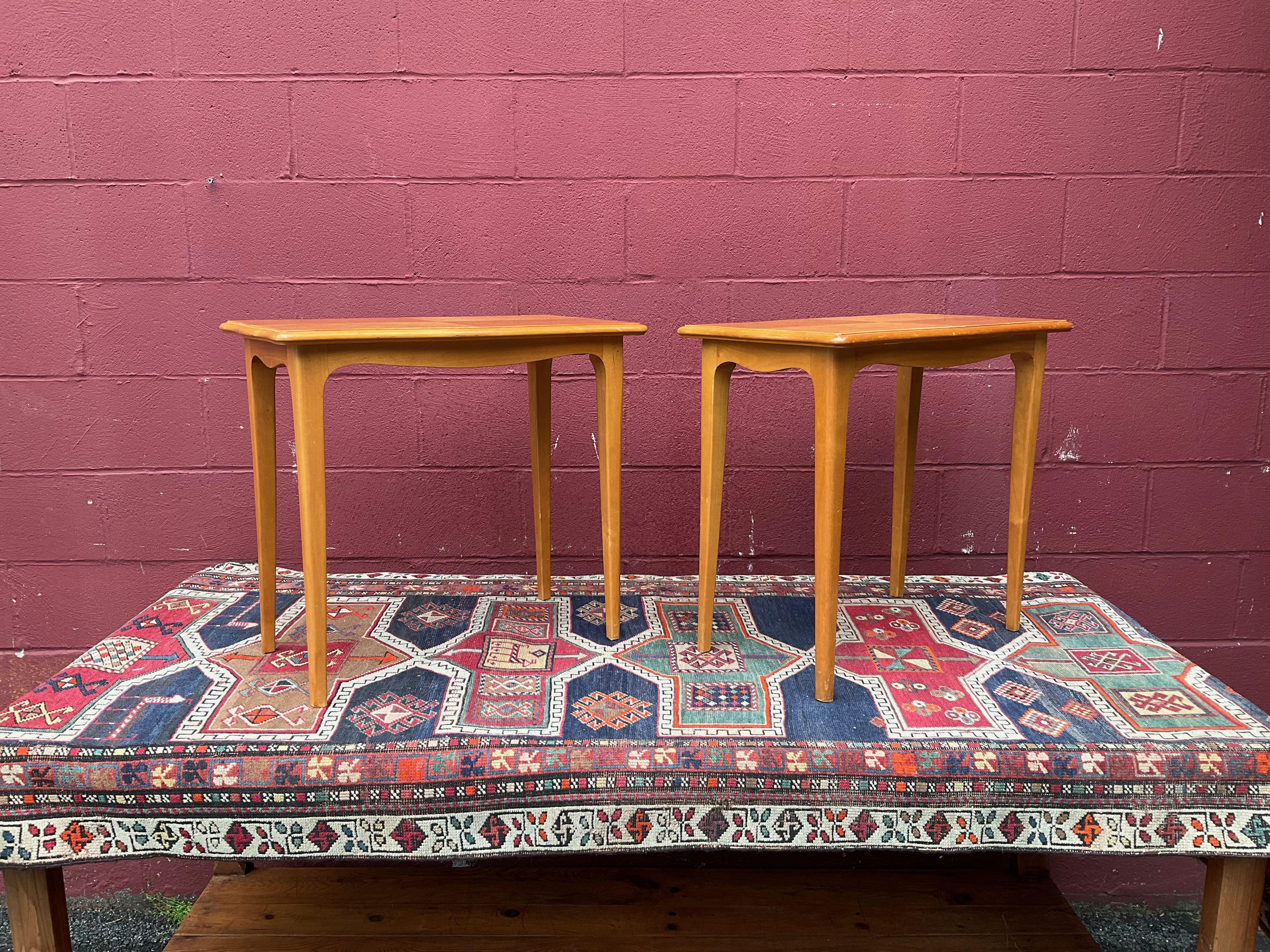 Pair of end tables in a light blonde wood, most likely Finnish.
 