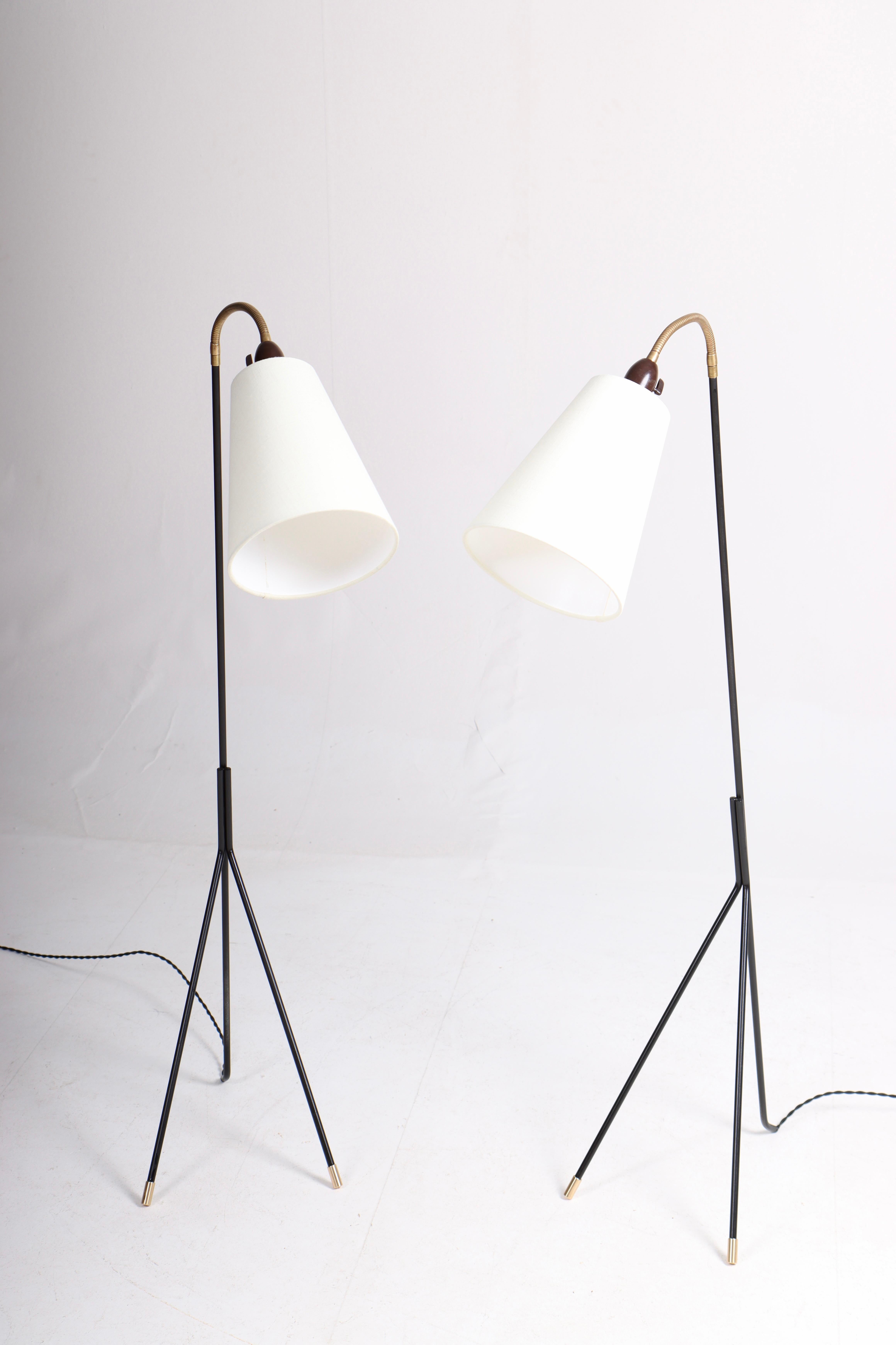 Great looking floor lamps in black painted metal and brass. Designed and made by S. A. Holm Sørensen in the mid-1950s. Great original condition.