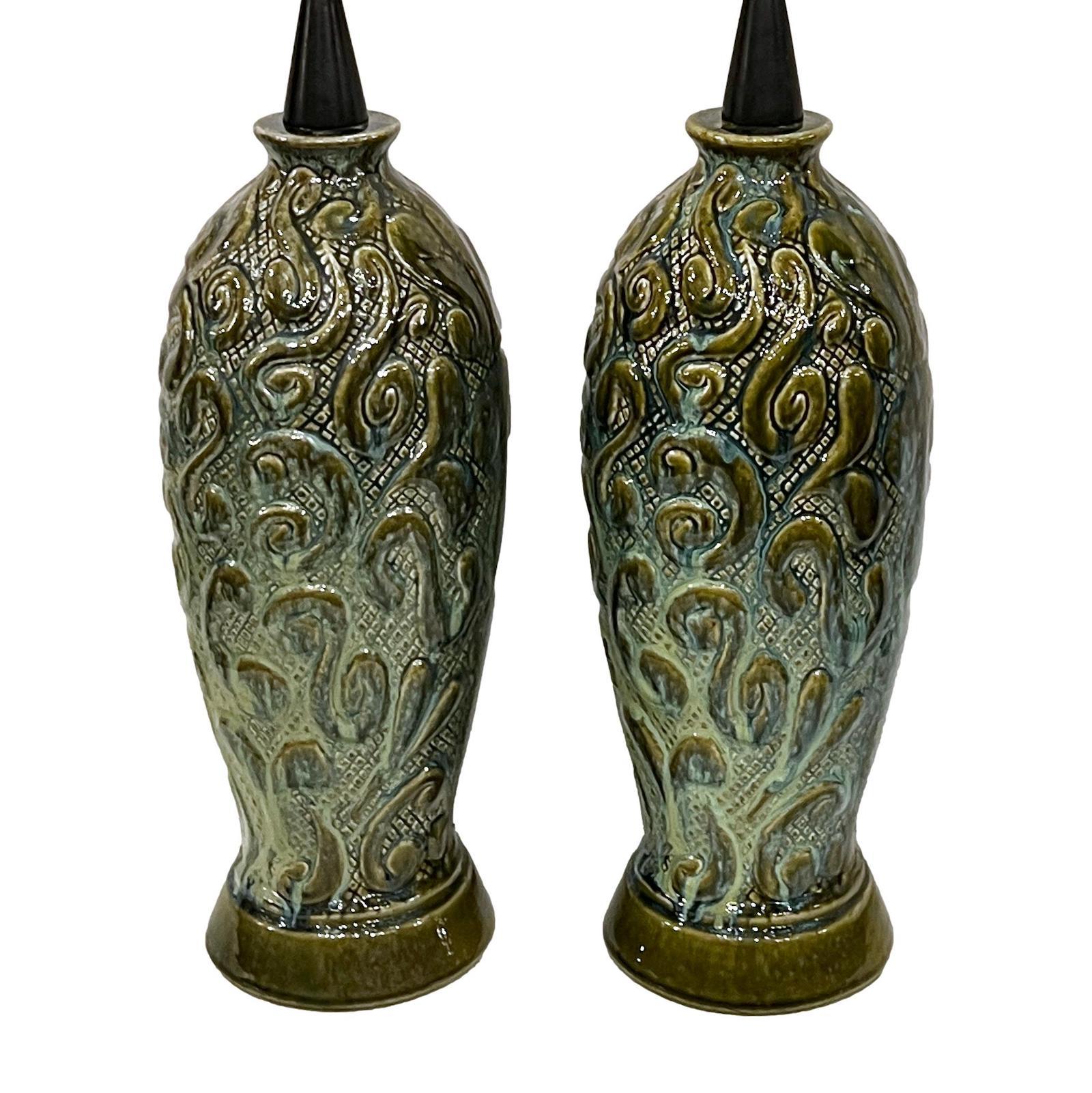 Pair of circa 1960s French table lamps with glazed porcelain stylised-foliage motif.

Measurements:
Height of body: 19