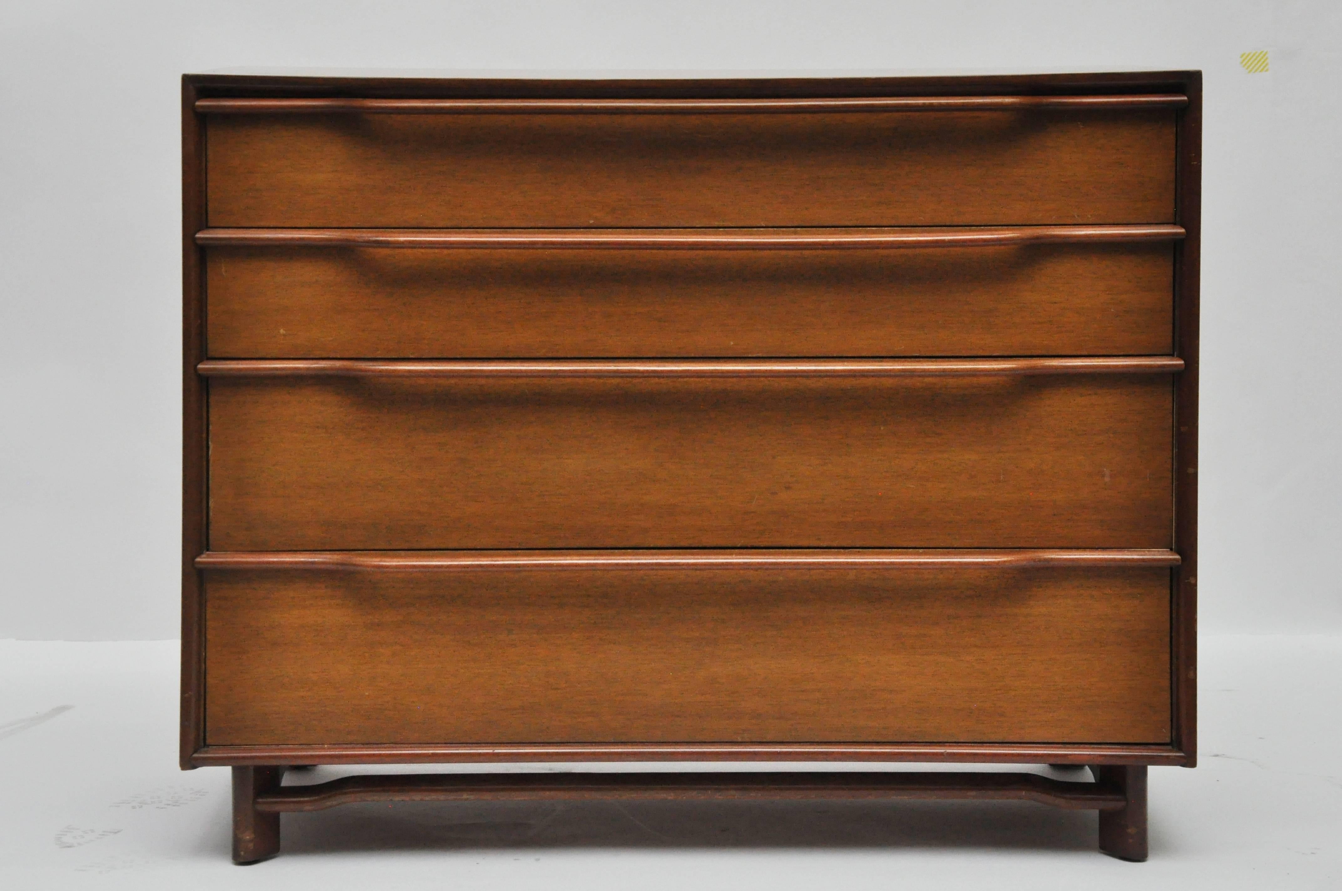 Pair of midcentury four-drawer chests in mahogany. There are scratches on sides as seen in the photos.