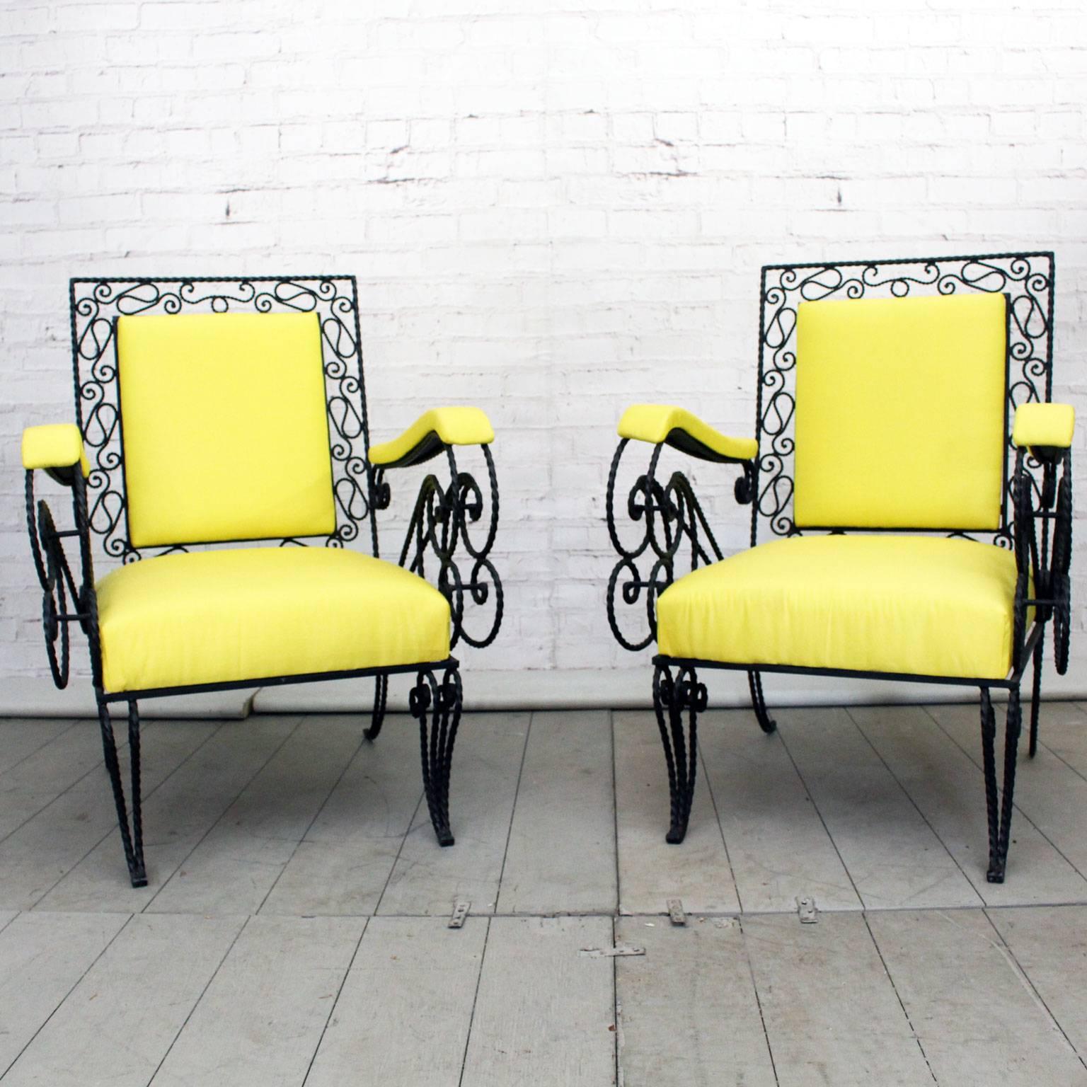 This very fine pair of ornate French armchairs has been reupholstered in yellow silk. They would work just as well inside or out. We love the three dimensional aspect of the twisted black metal work.
 