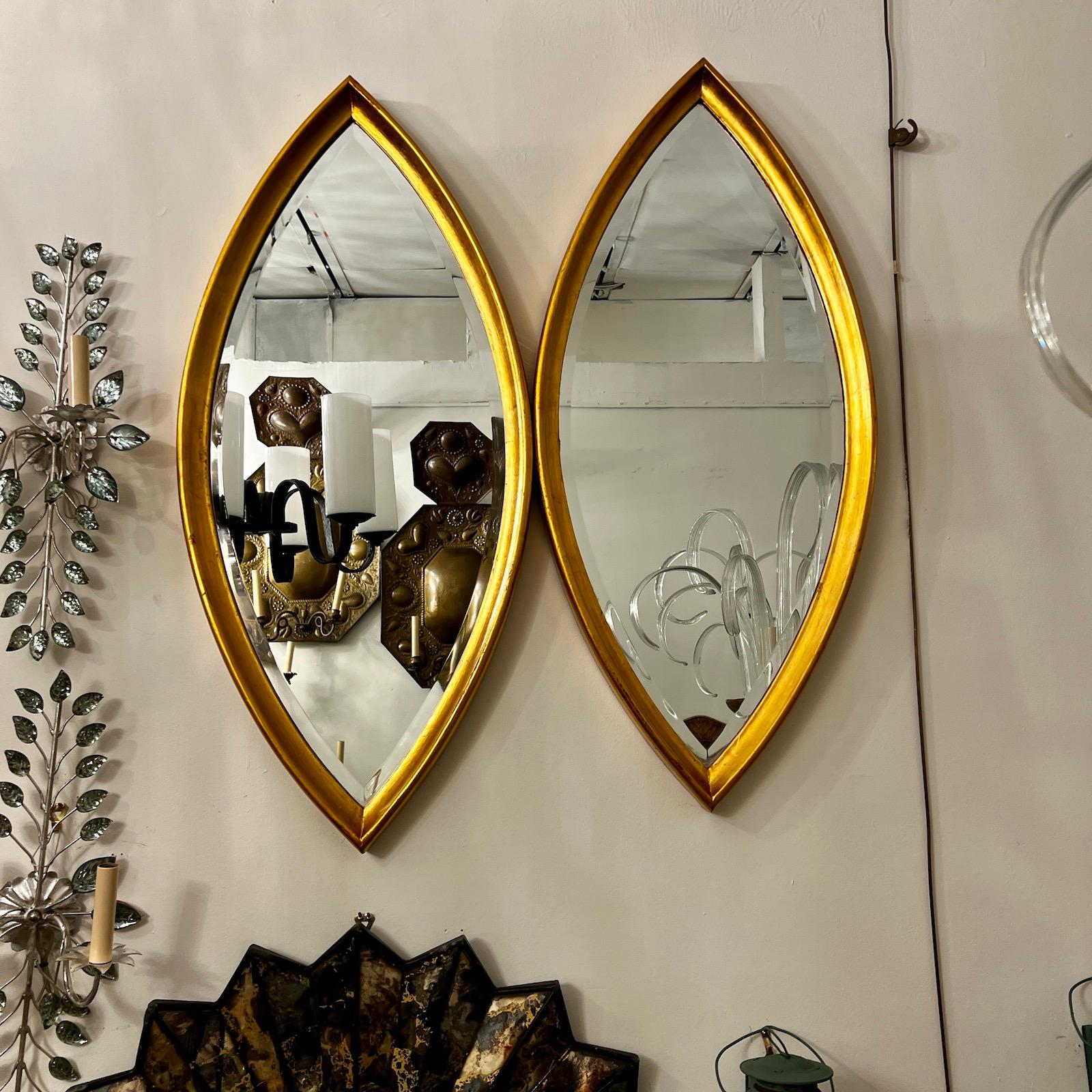 A pair of circa in 1950's gilt wood mirrors with original patina. Sold individually.

Measurements:
Length: 40