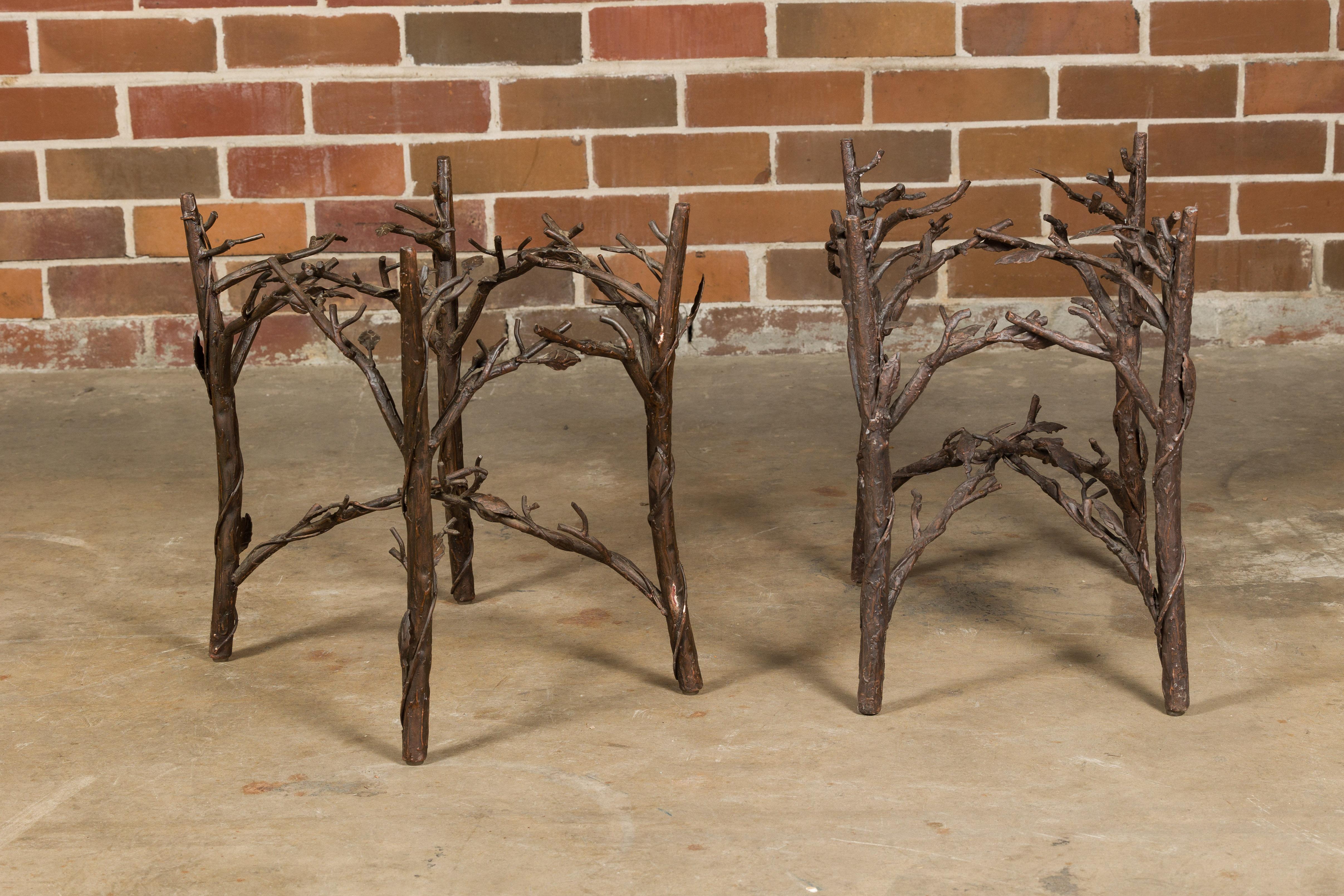 This pair of French iron twig drinks table bases from the mid-20th century exemplifies a whimsical yet elegant approach to design. Crafted from iron, these bases are intricately shaped to mimic the natural form of twigs and leaves, a testament to