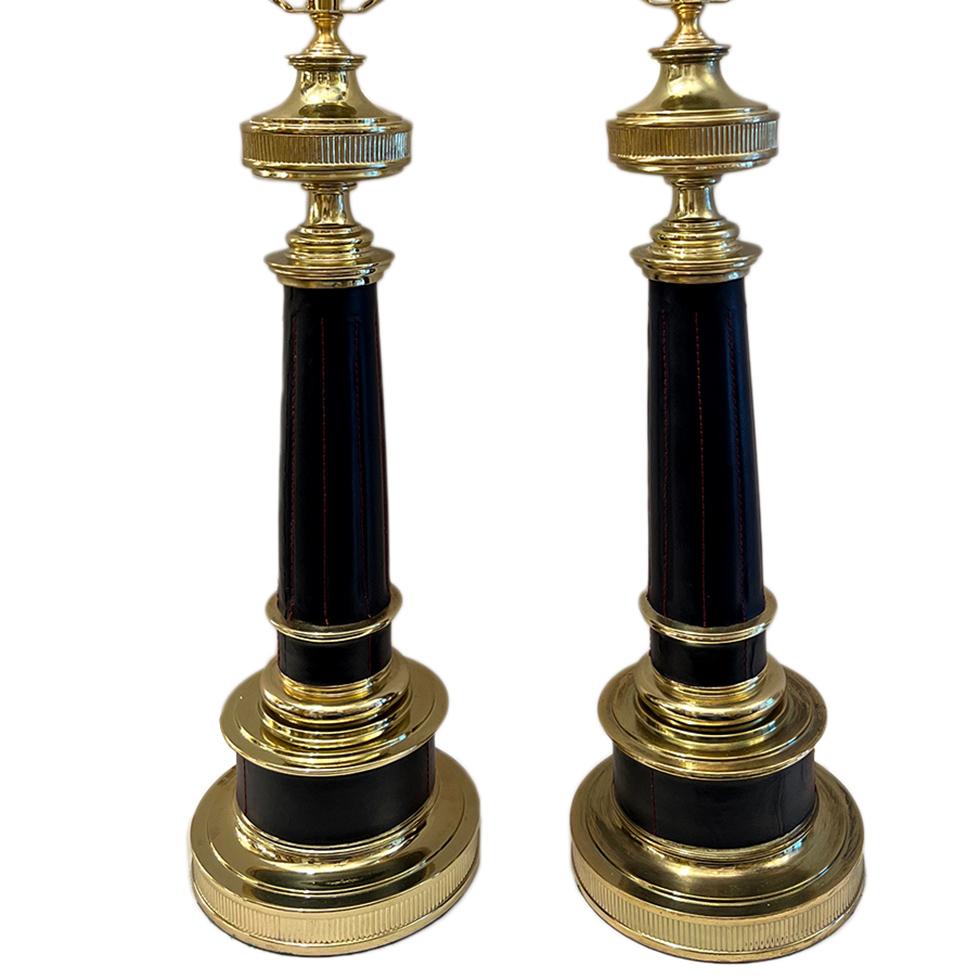 Pair of circa 1960's French bronze lamps with stitched leather body.

Measurements:
Height of body: 19.5