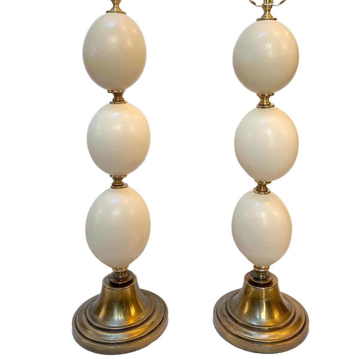 Pair of circa 1970's ostrich egg table lamps with bronze base and fittings.

Measurements:
Height of body: 28.25