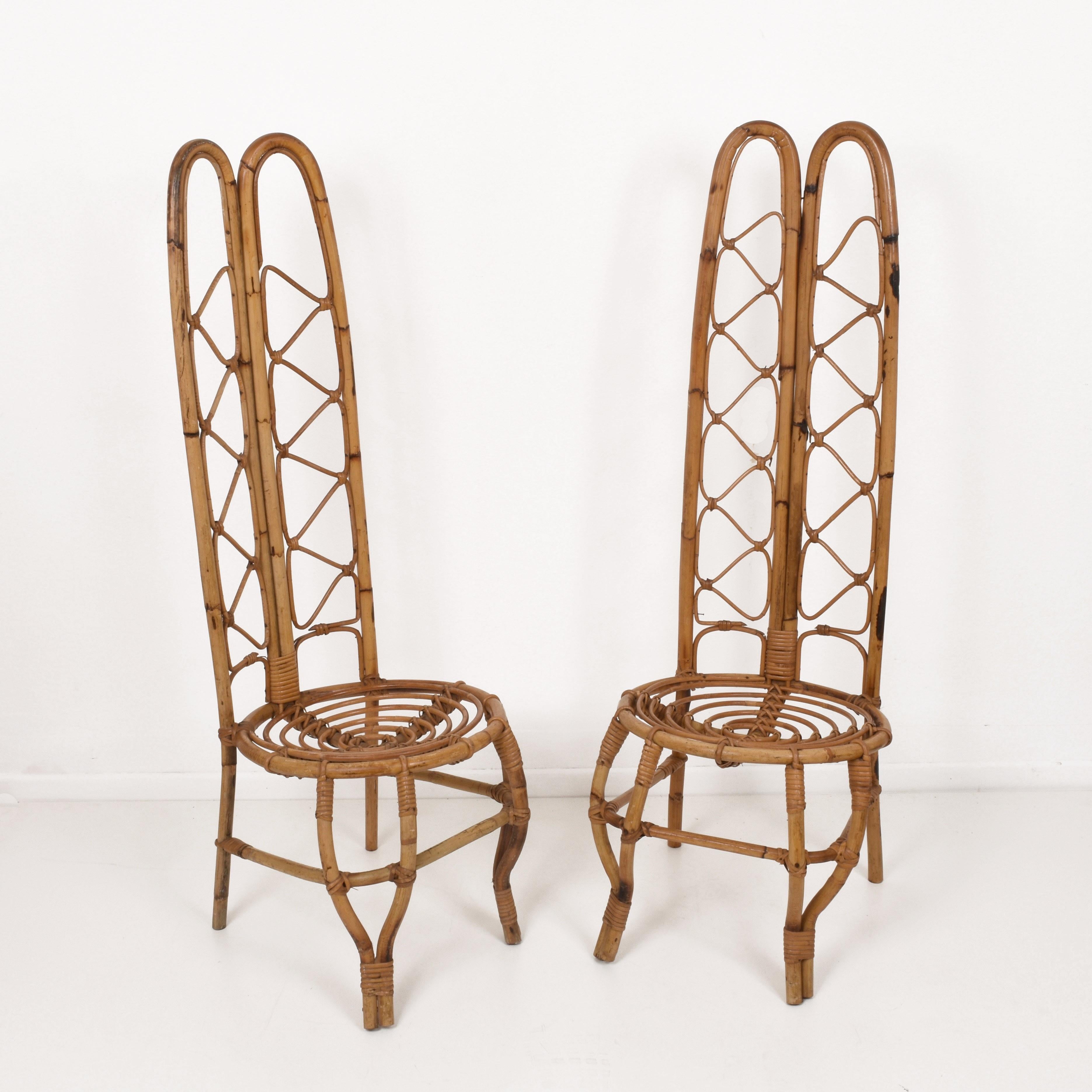 Wonderful pair of midcentury French Riviera rattan and bamboo chairs. This marvellous set was produced in France during the 1960s.

They are unique as they have a very high back seat made of mixed rattan and bamboo.

This amazing chair will give