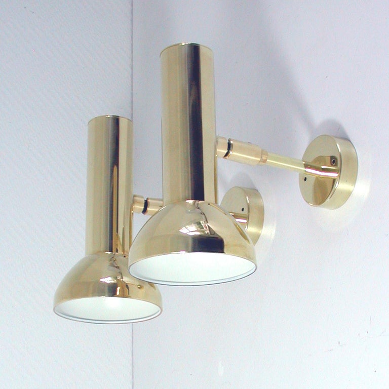This elegant pair of midcentury wall lights was designed and manufactured in Germany in the 1960s by Gebruder Cosack.

They are made of brass and are adjustable. They can be used as wall lights as wenn as ceiling lights.

The lamps are in full
