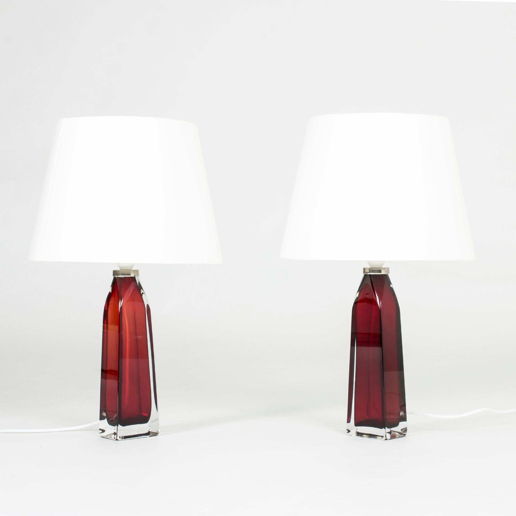 Pair of striking glass table lamps by Carl Fagerlund, made from rich red glass, rectangular at the base. Beautiful translucent color, elegant design.