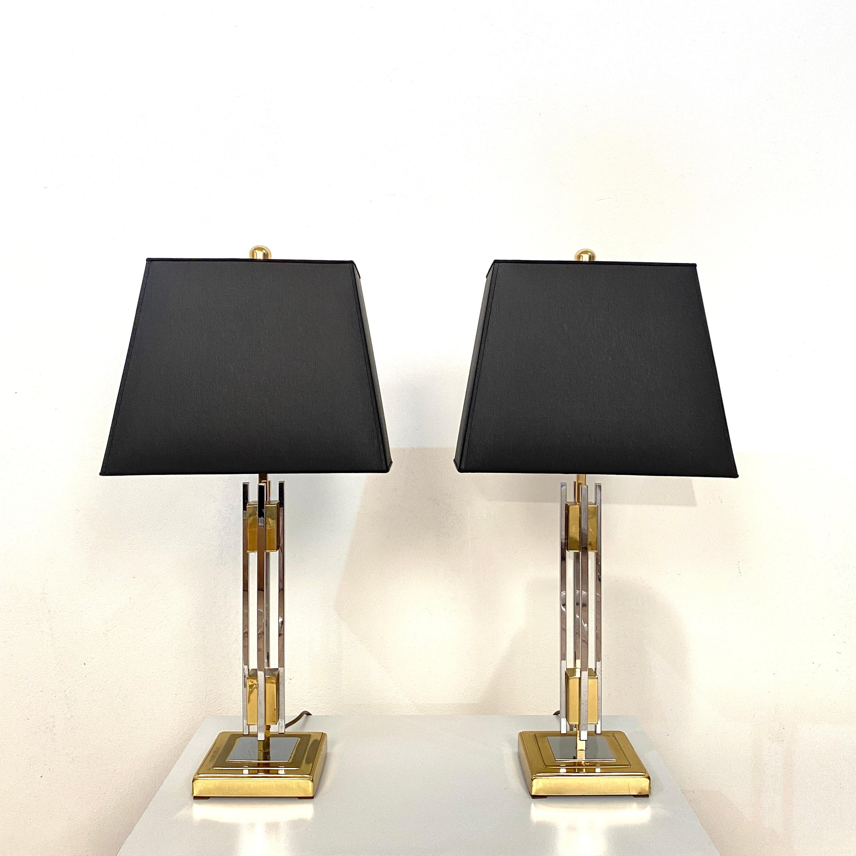 Those elegant and beautiful pair of midcentury gold and chrome table lamps by Willy Rizzo where made in the 1970s.
The lamps are in good vintage condition. One of them has some fading of the gold on the base.
The lamp shades are re-done in black