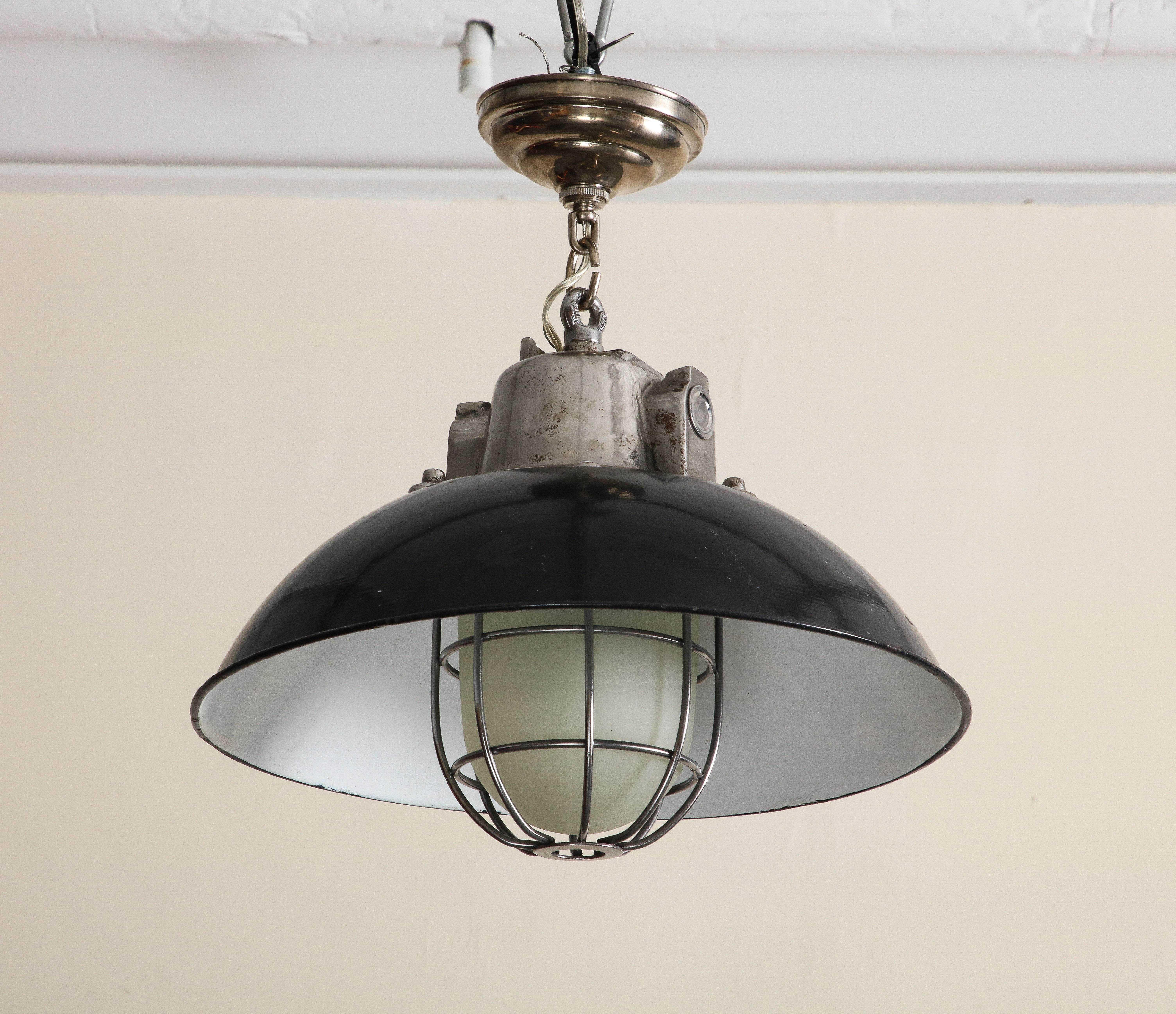Cast Pair of Midcentury Industrial Style Cage Pendant Lights with Black Enamel Shade For Sale