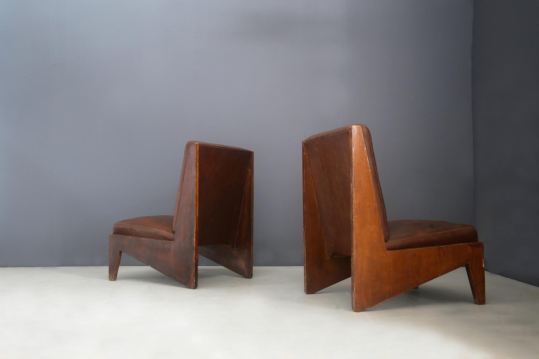 Pair of beautiful Italian armchairs attributed to the BBPR studio of 1950. The armchairs are waiting for certain documentation. The seats have a structure in walnut wood in first patina and are in original condition, after purchase will be restored