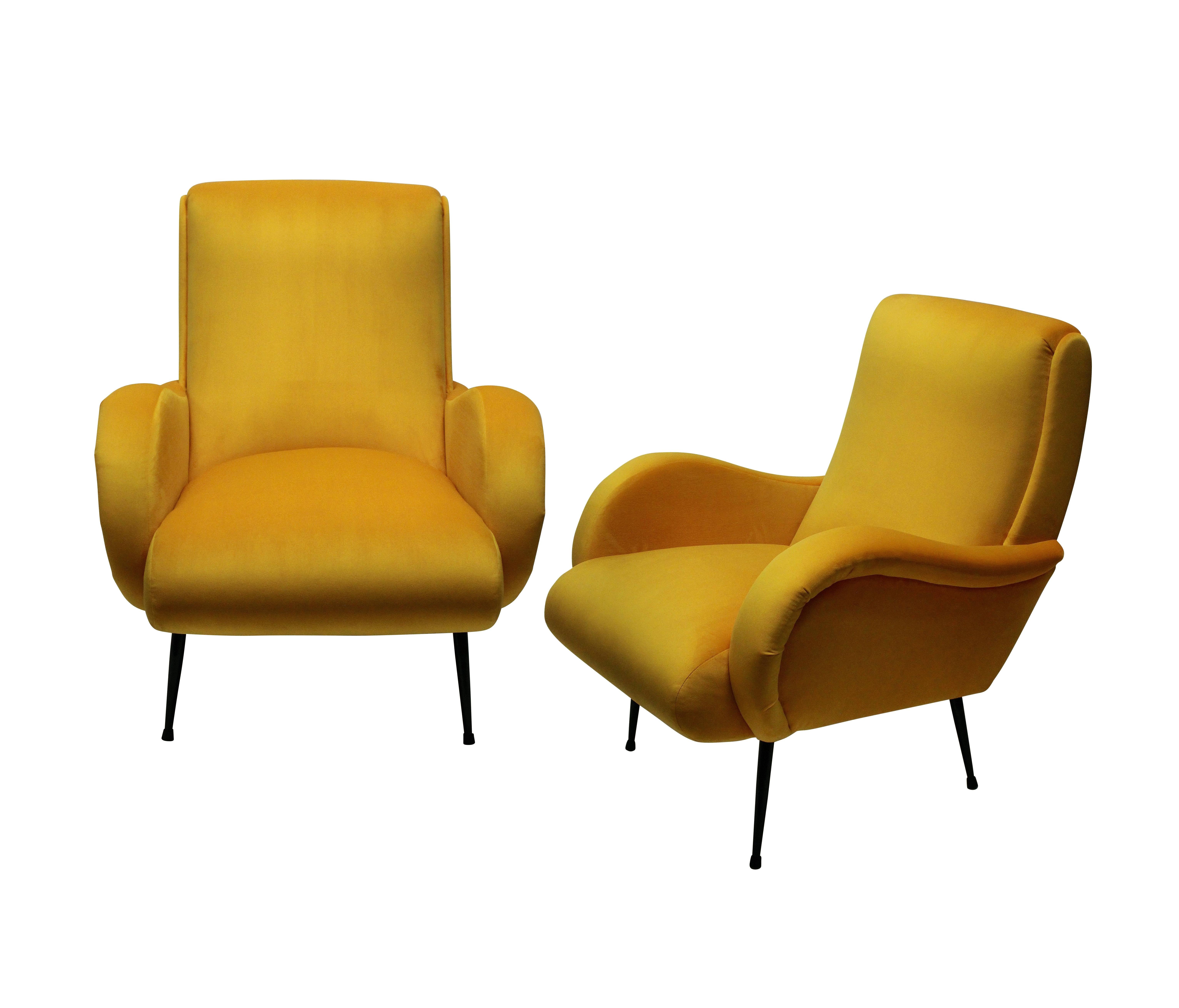 A pair of stylish and comfortable Italian midcentury armchairs, newly upholstered in warm yellow velvet.