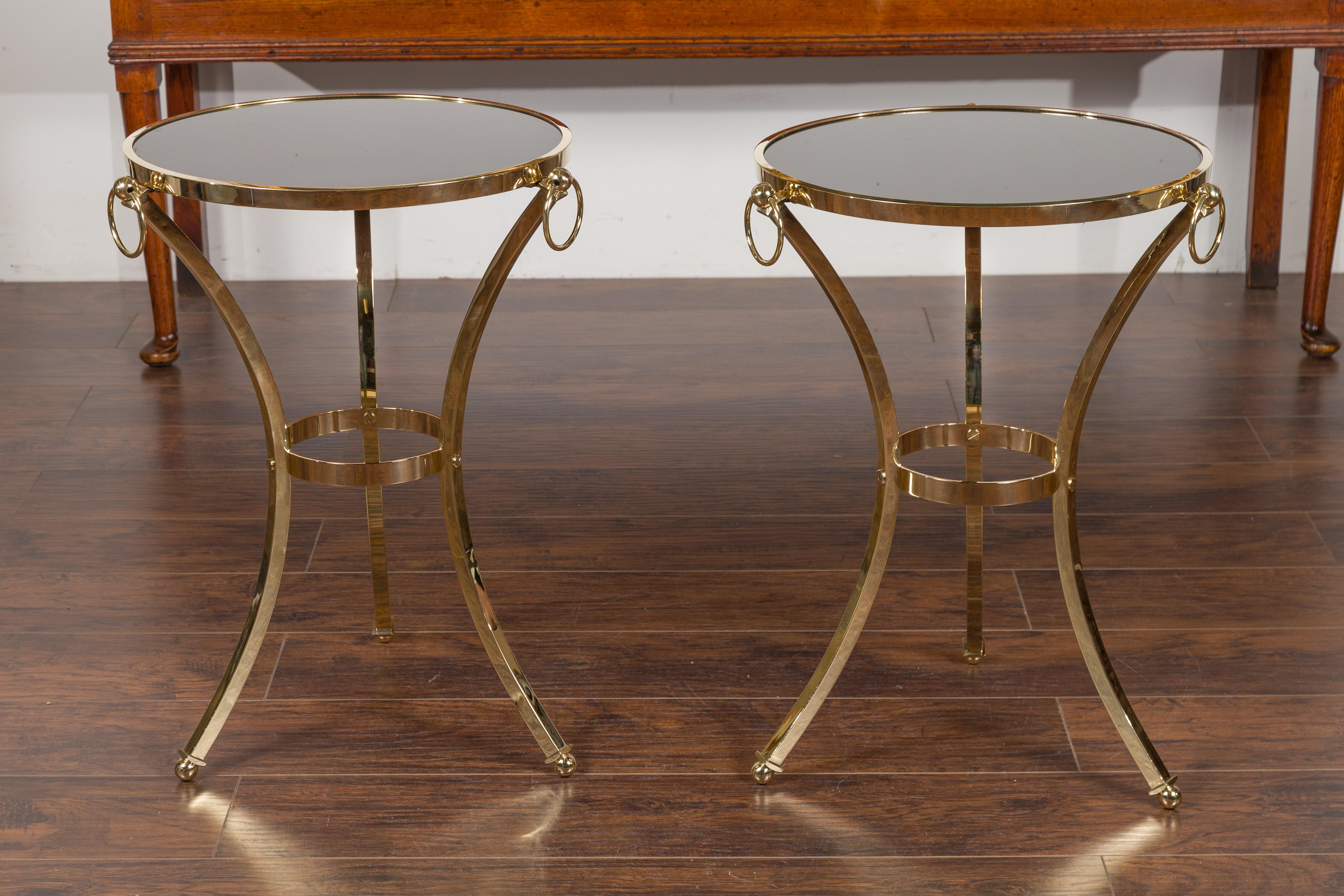 Mid-Century Modern Pair of Midcentury Italian Brass Tables with Black Mirrored Tops and Ring Motifs For Sale
