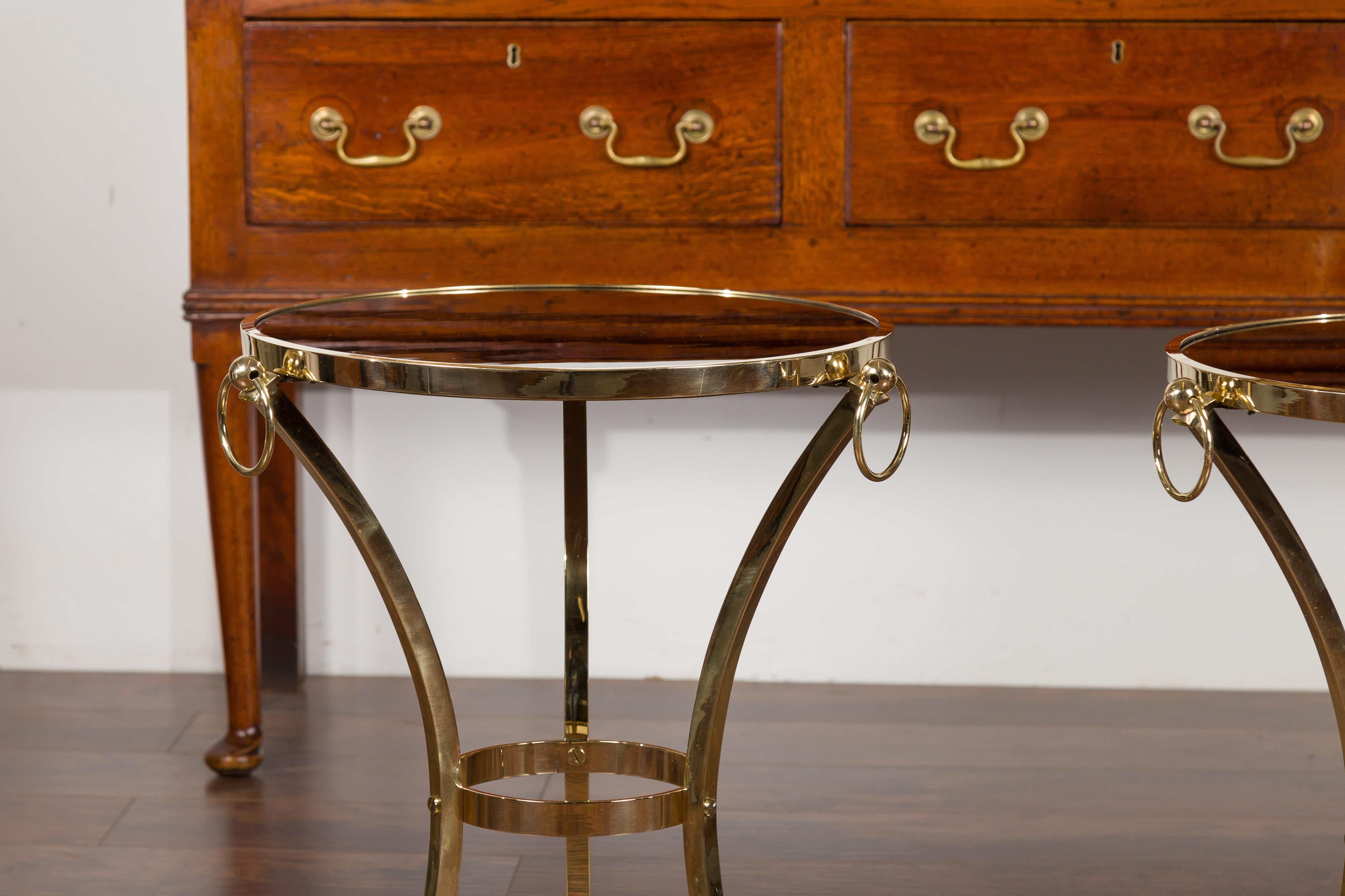 20th Century Pair of Midcentury Italian Brass Tables with Black Mirrored Tops and Ring Motifs For Sale