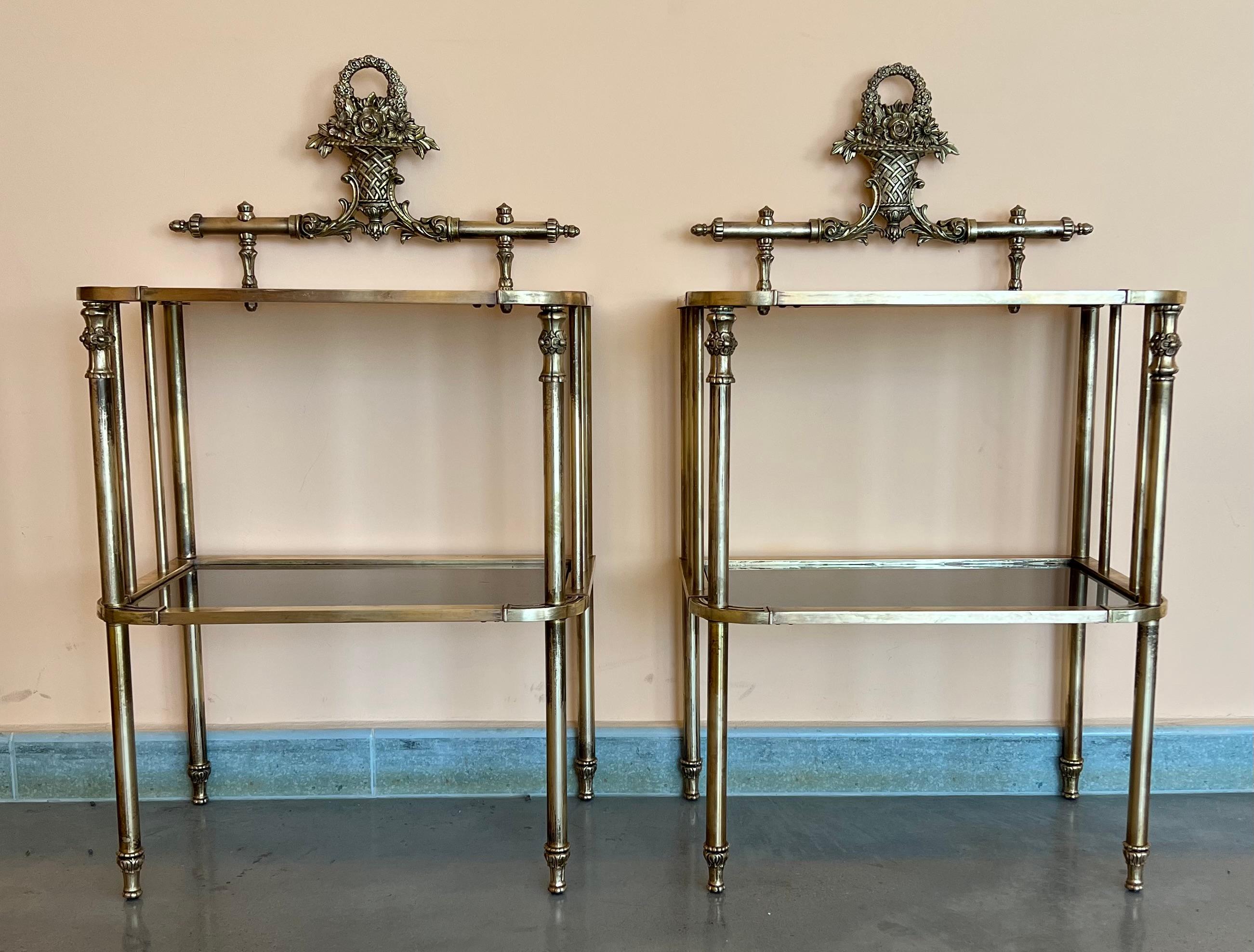 Pair of Midcentury Italian two tier bronze and glass nightstands with crest.