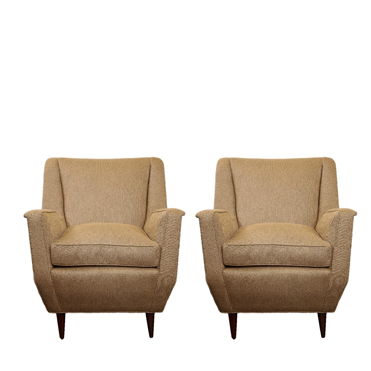 Sit back and relax. Comfortable and well proportioned club chairs with legs in mahogany. Upholstered by Venfield in gold Holly Hunt high performance fabric. Italy, 1950s.