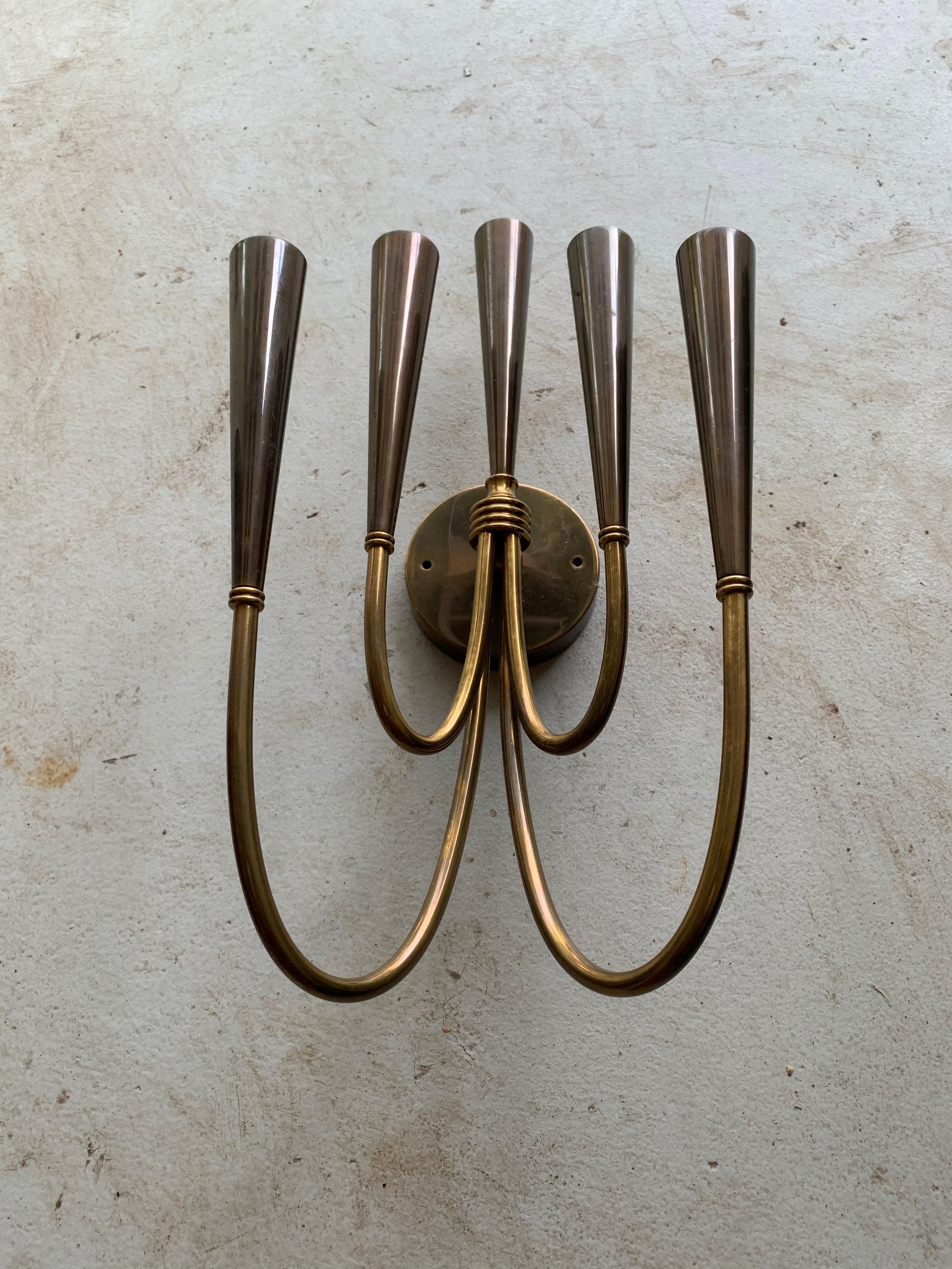 A pair of period midcentury sconces in Brass accented in gray metallic, each with five arms.

In the style of Stilnovo.

Dimensions: 14 height x 8 width x 6.5 deep x 3.5 backplate.