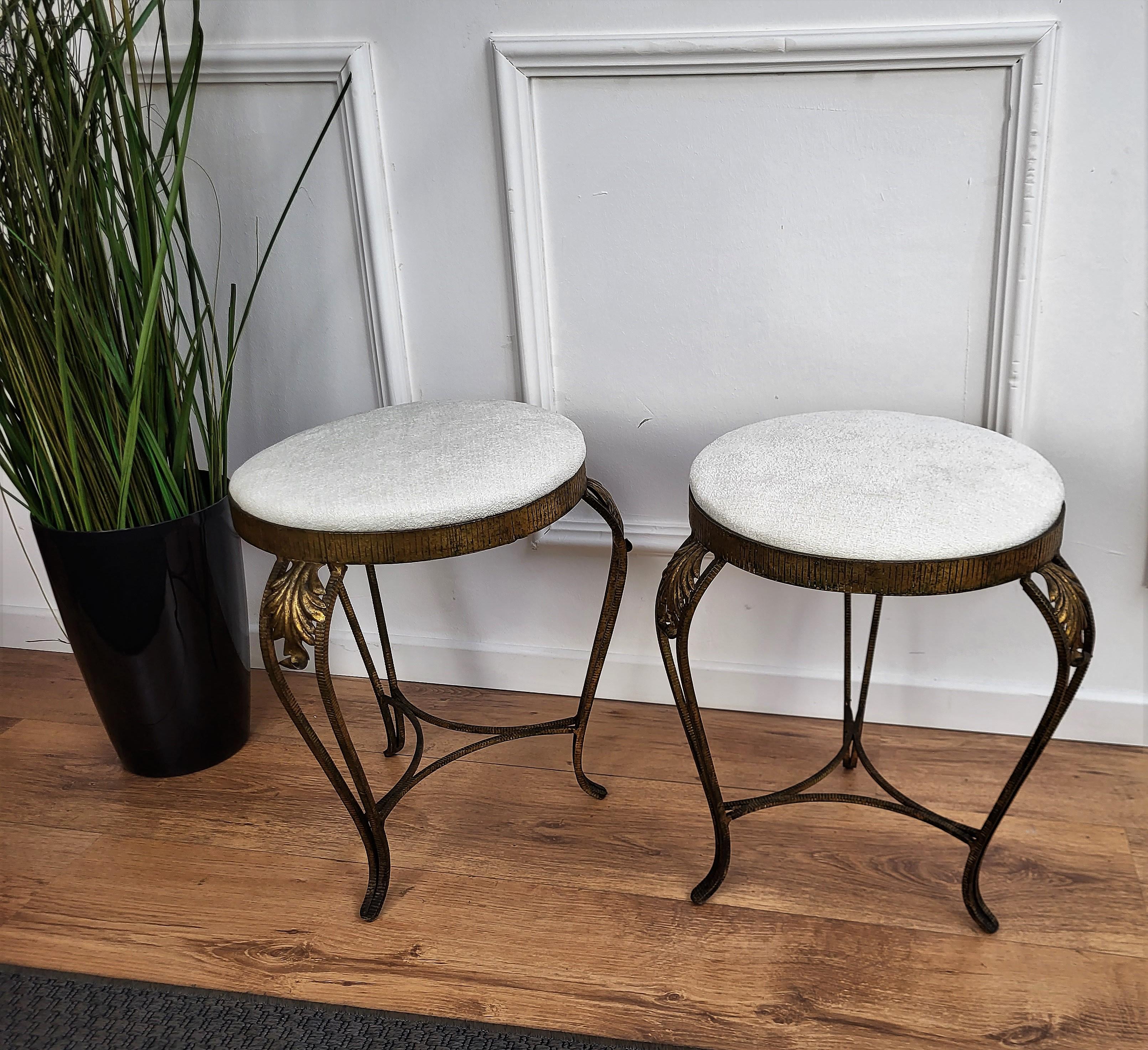 Very simple, stylish and elegant gilt brass tripod stools with white velvet new upholstery. They would make a fine fireside perch, tall footrest, or seats for a writing table.